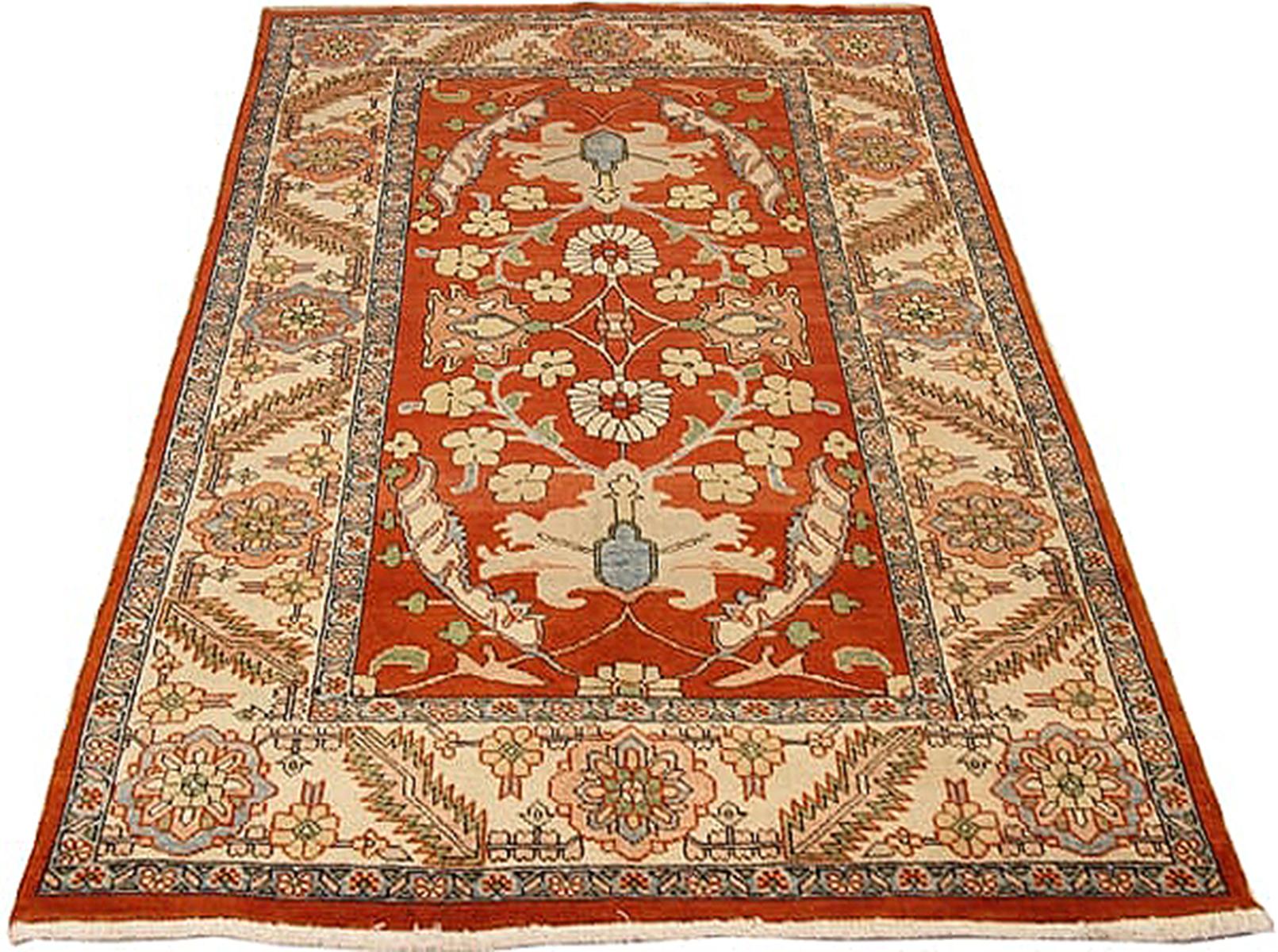 Vintage Persian rug handwoven from the finest sheep’s wool and colored with all-natural vegetable dyes that are safe for humans and pets. It’s a traditional Heriz design featuring a lovely ivory and red field covered with gray and beige floral and