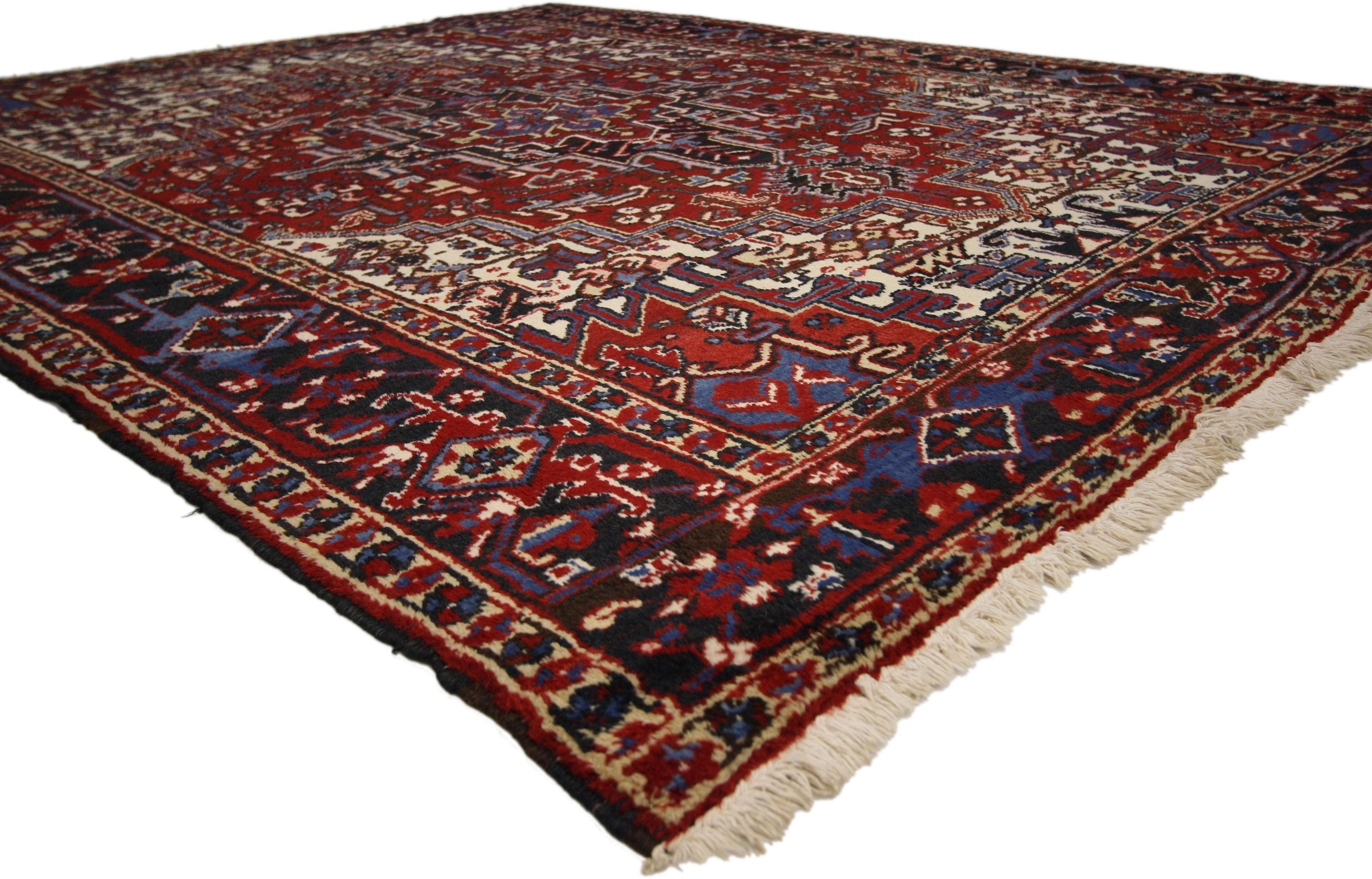 71255, vintage Persian Heriz rug with Manor House and Tudor style. This vintage Persian Heriz rug features a Mid-Century Modern style in traditional colors. Rendered in red, navy, blue, and ivory with accents of brown. This vintage Heriz rug has