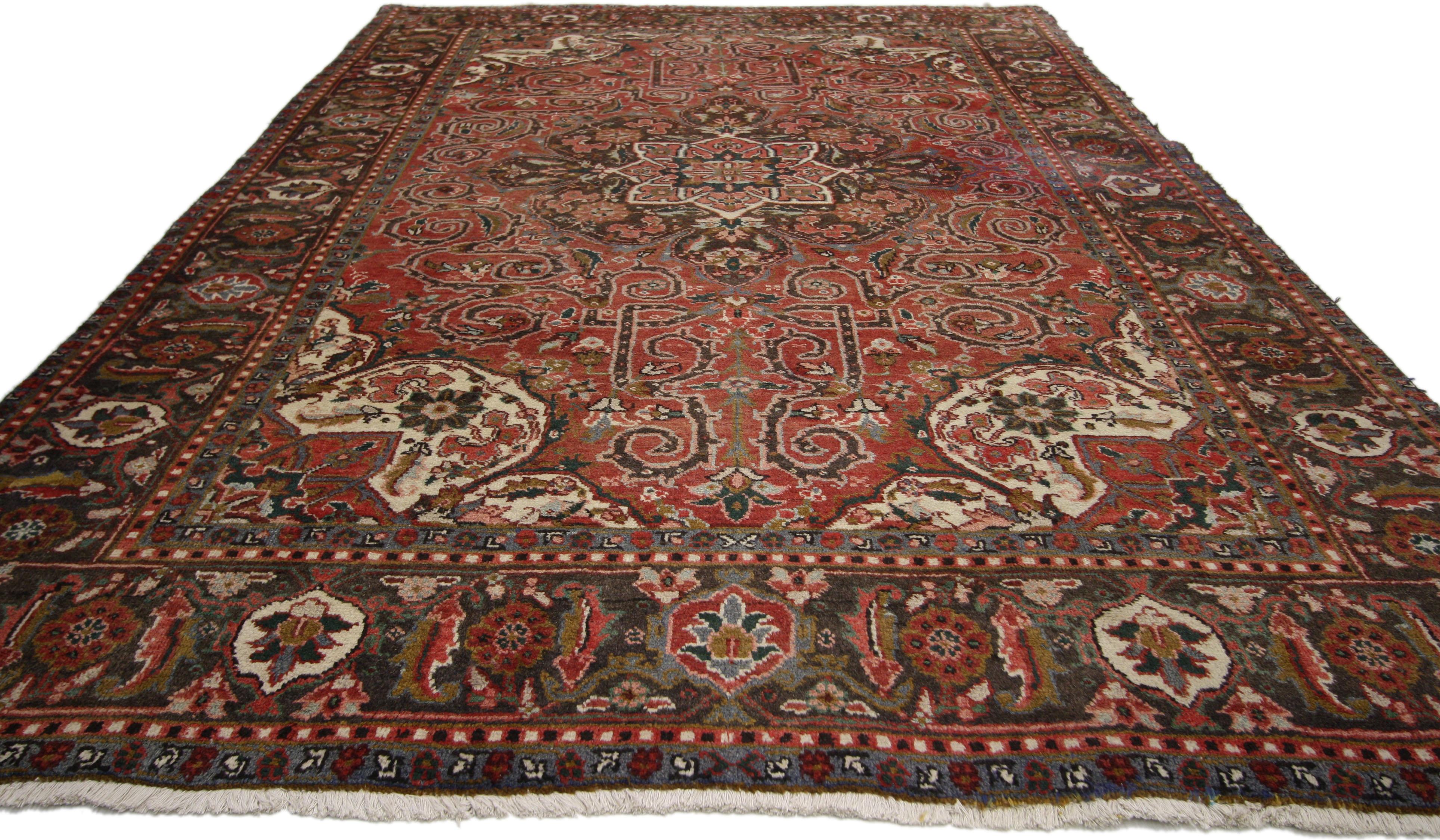 76226 vintage Persian Heriz rug with Mid-Century Modern English Tudor Cottage style. Traditional and regal with warm colors, this vintage Persian Heriz area rug with Modern English Cottage Tudor style is comprised of a prominent octagram medallion