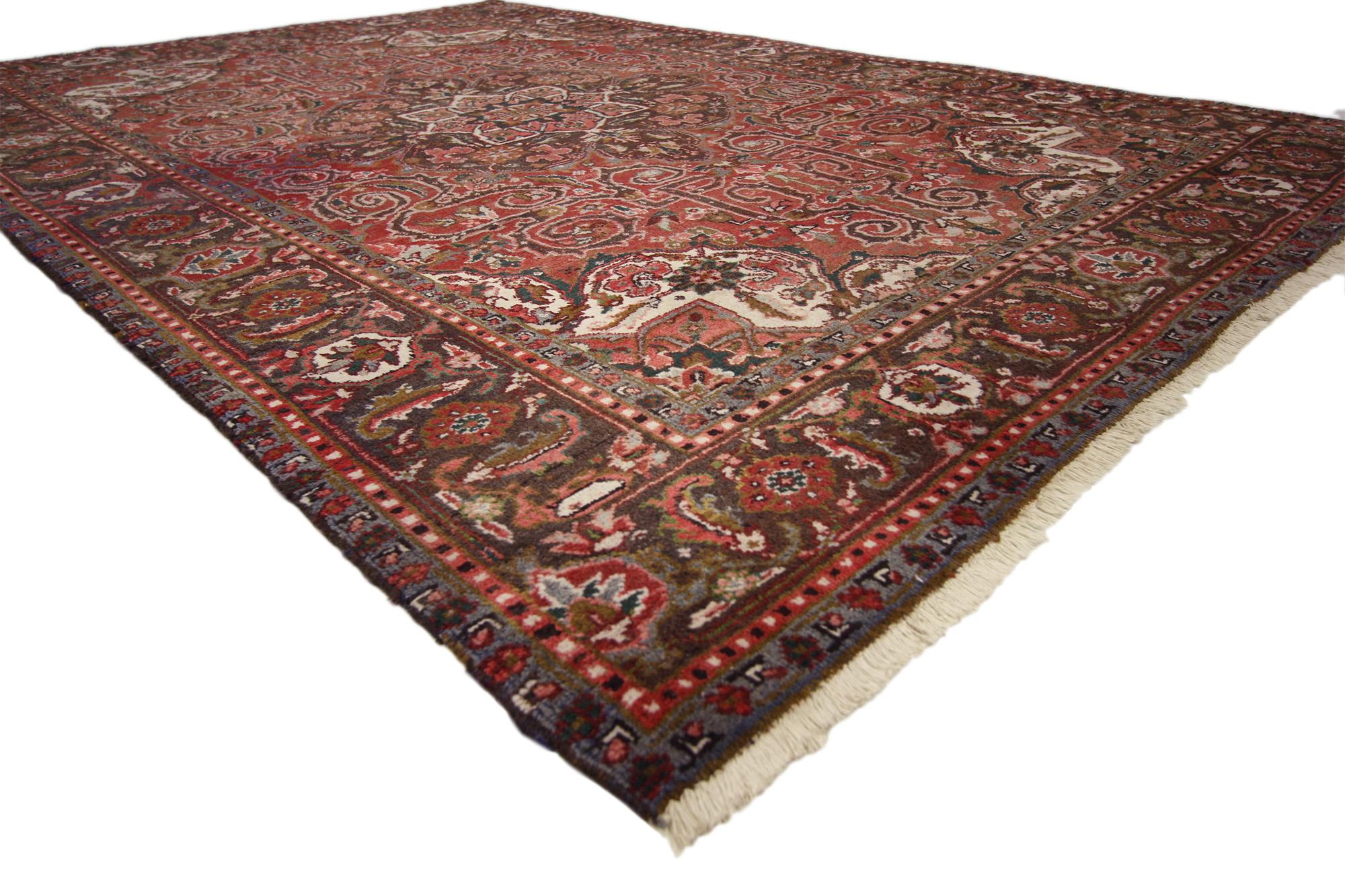 76226 Vintage Persian Heriz Rug, 06'04 x 09'08. Steeped in tradition and woven with an artistic flair, this hand-knotted wool vintage Persian Heriz rug embodies the bold spirit of northwestern Iran’s most celebrated weaving heritage. Its intricate