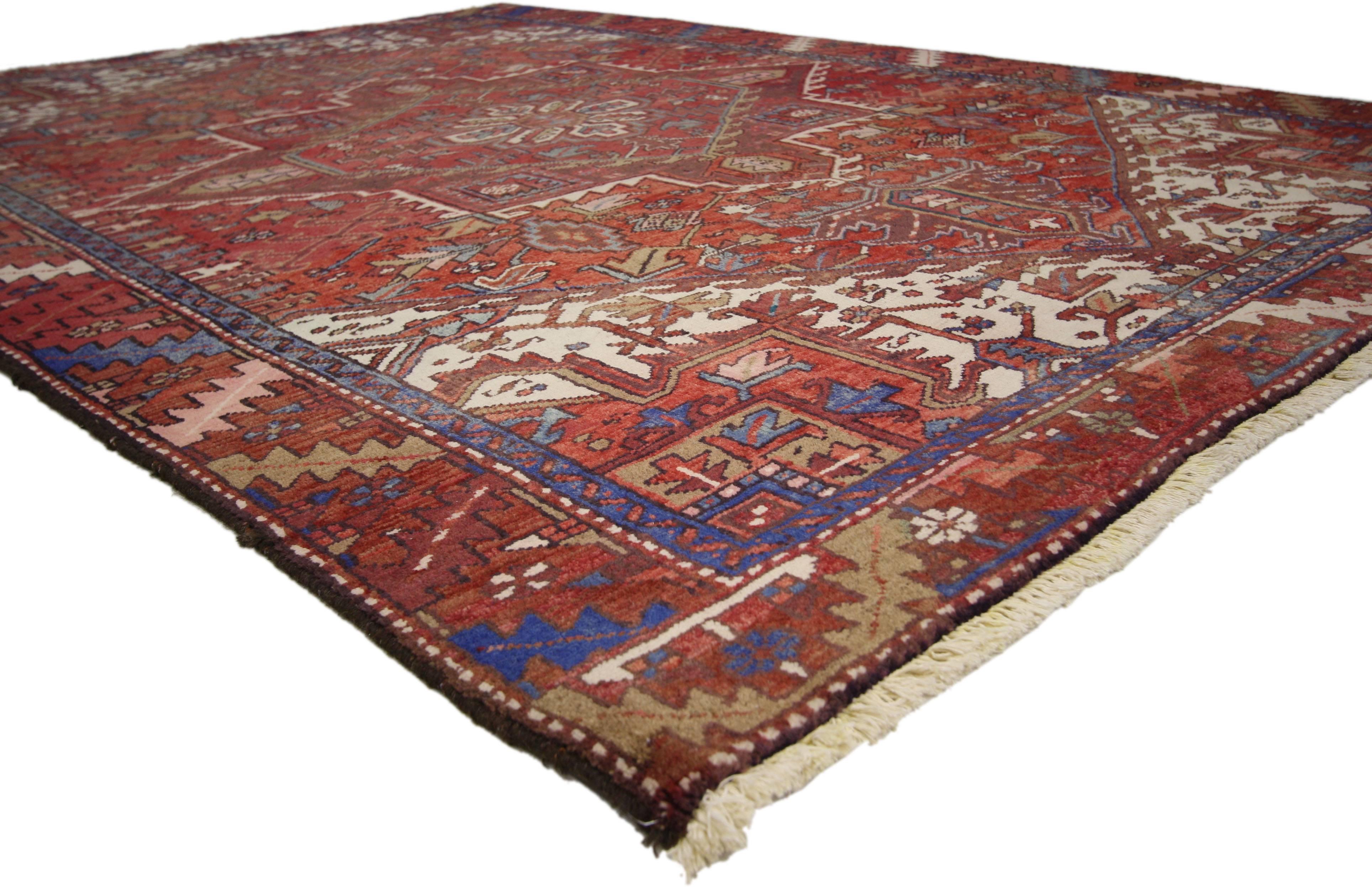 76242, Vintage Persian Heriz Rug with modern English Cottage Tudor style. Traditional and regal with brilliant color, this vintage Persian Heriz area rug with Modern English Cottage Tudor style is comprised of a prominent octagram medallion flanked