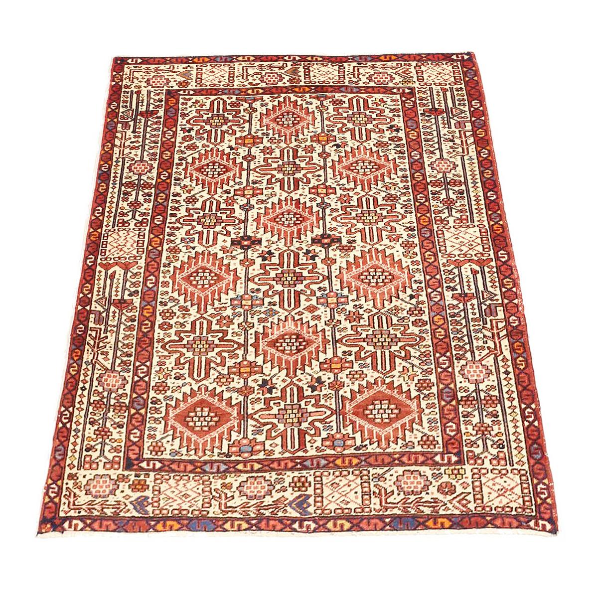 Vintage Persian rug handwoven from the finest sheep’s wool and colored with all-natural vegetable dyes that are safe for humans and pets. It’s a traditional Heriz design featuring a lovely ivory field covered with red and black floral and nature