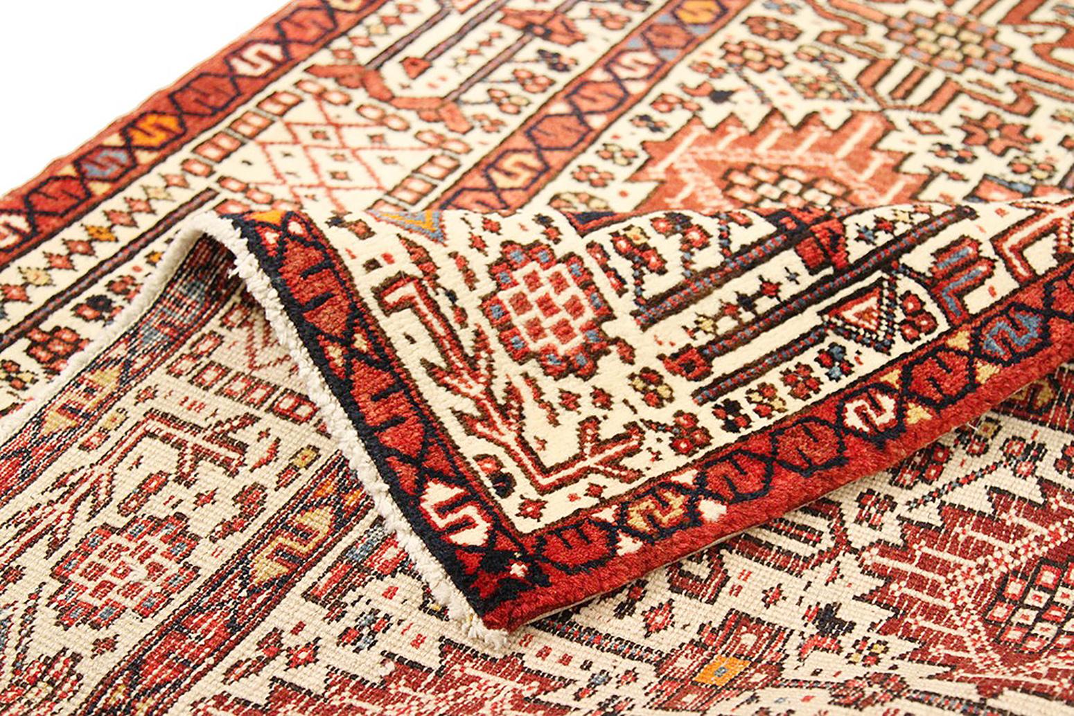 Heriz Serapi Vintage Persian Heriz Rug with Red and Black Flower Motifs on Ivory Field For Sale