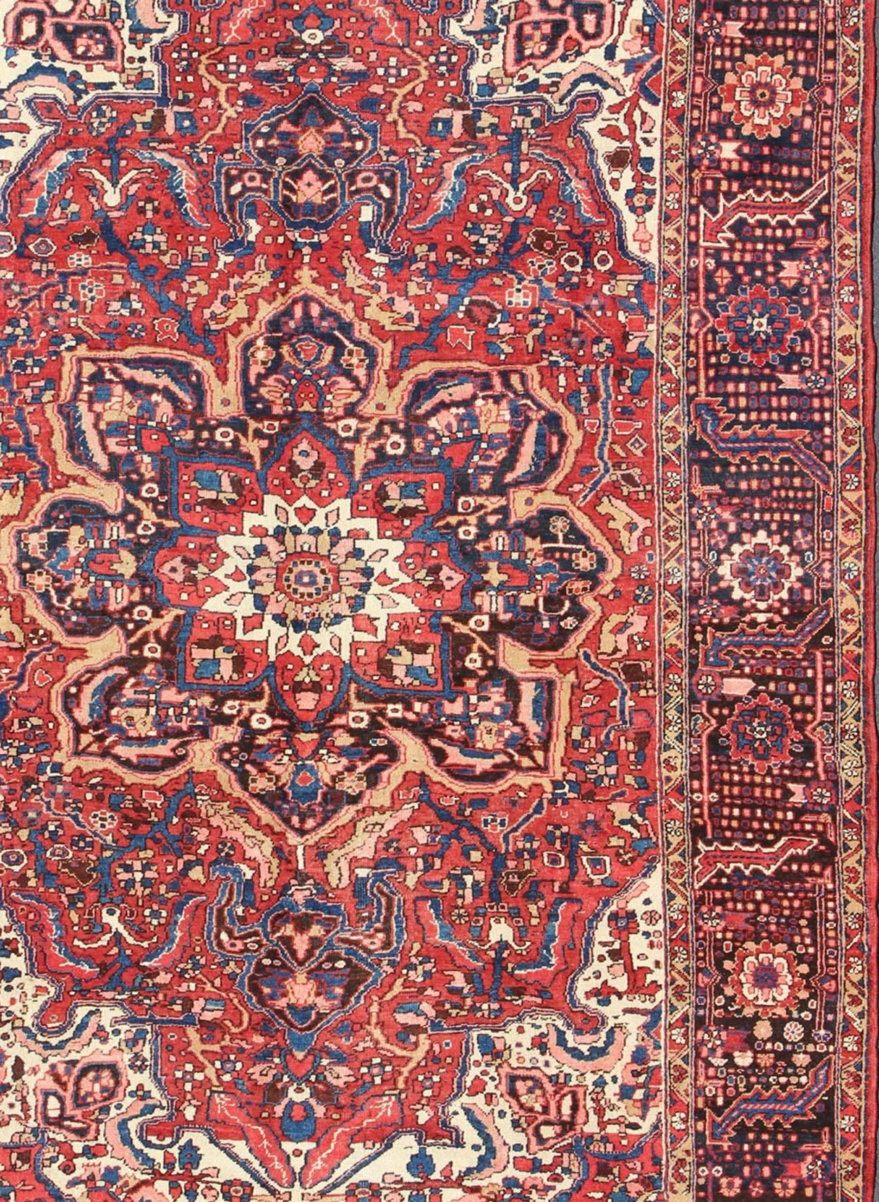 Heriz Serapi Semi Antique Persian Heriz Rug with Stylized Medallion Design in Red and Blue For Sale