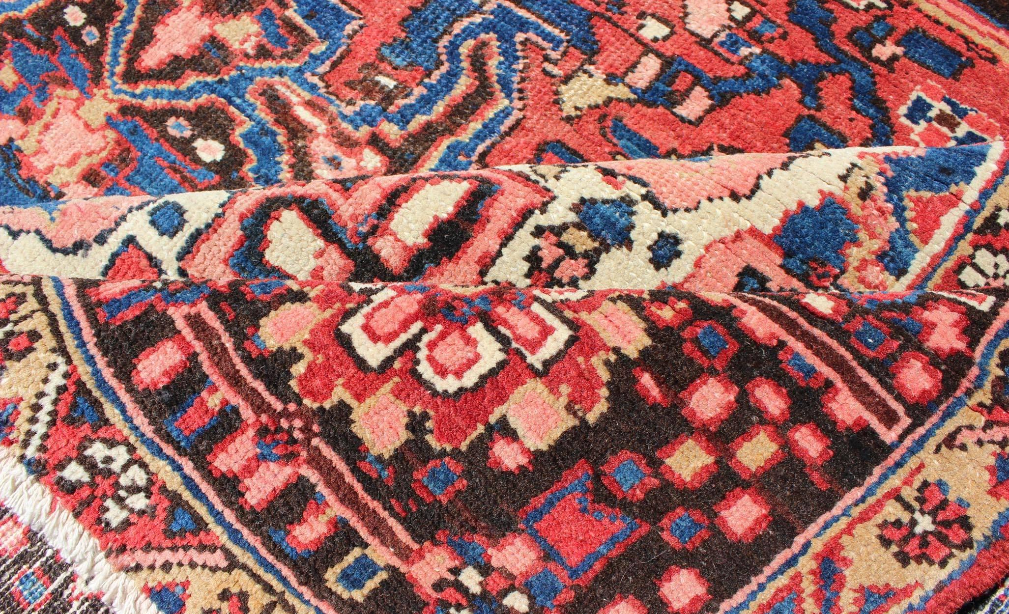 Hand-Knotted Semi Antique Persian Heriz Rug with Stylized Medallion Design in Red and Blue For Sale