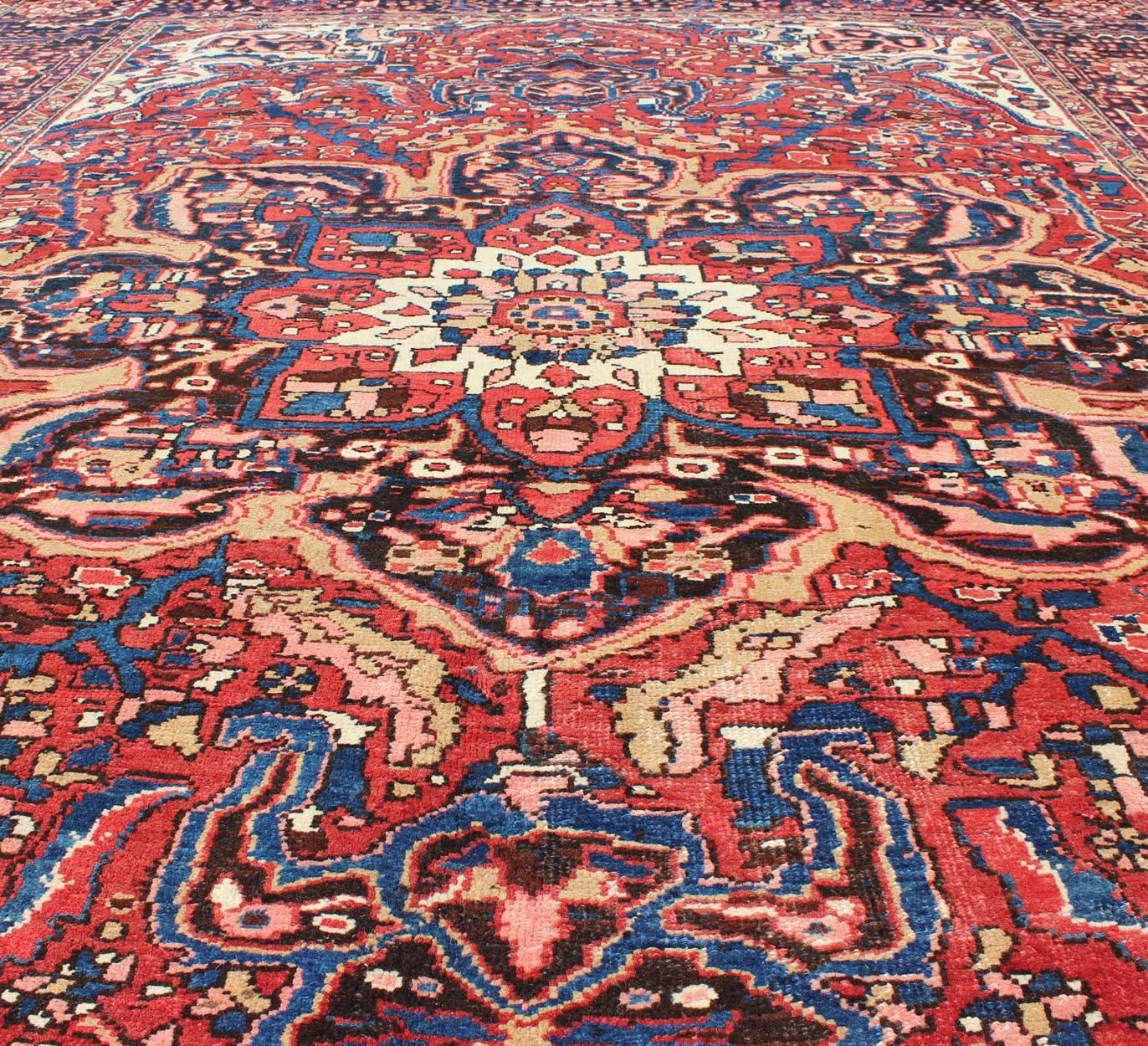 Semi Antique Persian Heriz Rug with Stylized Medallion Design in Red and Blue In Good Condition For Sale In Atlanta, GA