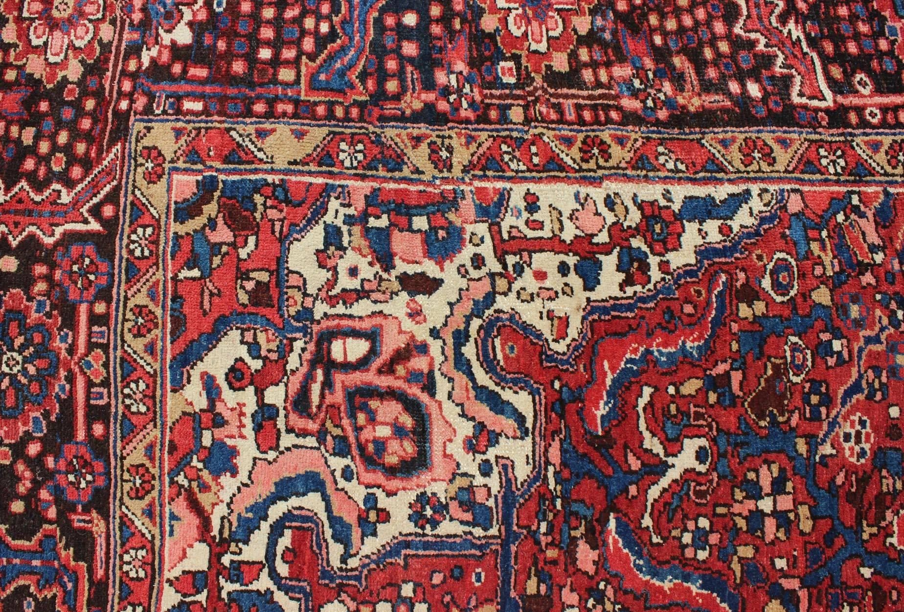 Semi Antique Persian Heriz Rug with Stylized Medallion Design in Red and Blue For Sale 1
