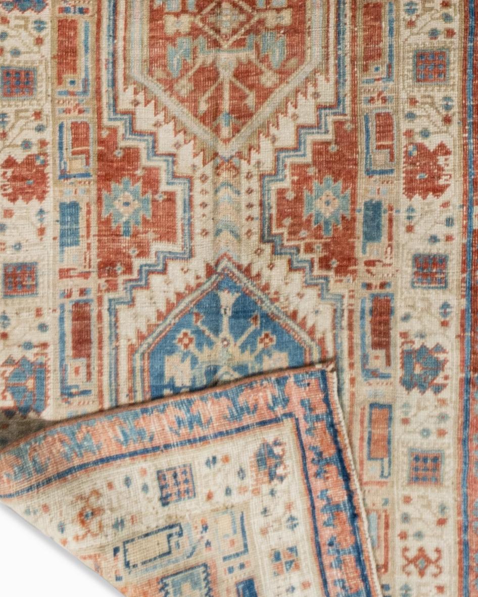 Vintage Persian Heriz runner 3' x 14'7. As perpetually fashionable as they are collectible, traditional Heriz luxury handmade rugs are skillfully woven in vibrant colors and emphatic geometric designs. The Heriz district of NW Persia has been