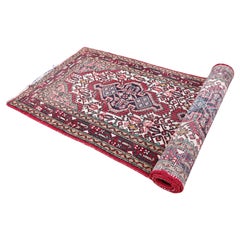 Vintage Persian Heriz Runner in various tones of red, pink and ivory wool