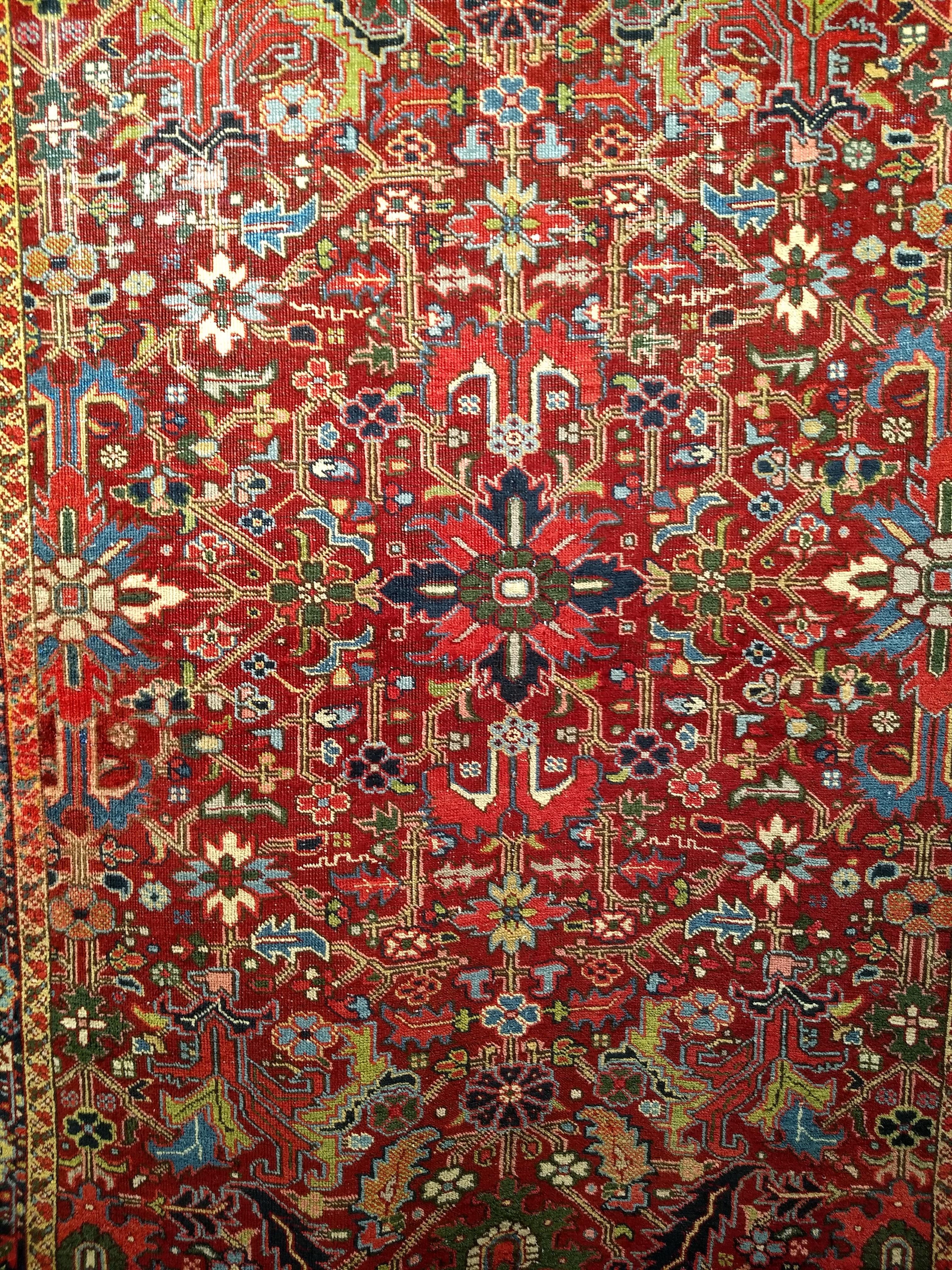 Hand-Knotted Vintage Persian Heriz Serapi in an All-Over Pattern in Red, Yellow, Green, Pink For Sale