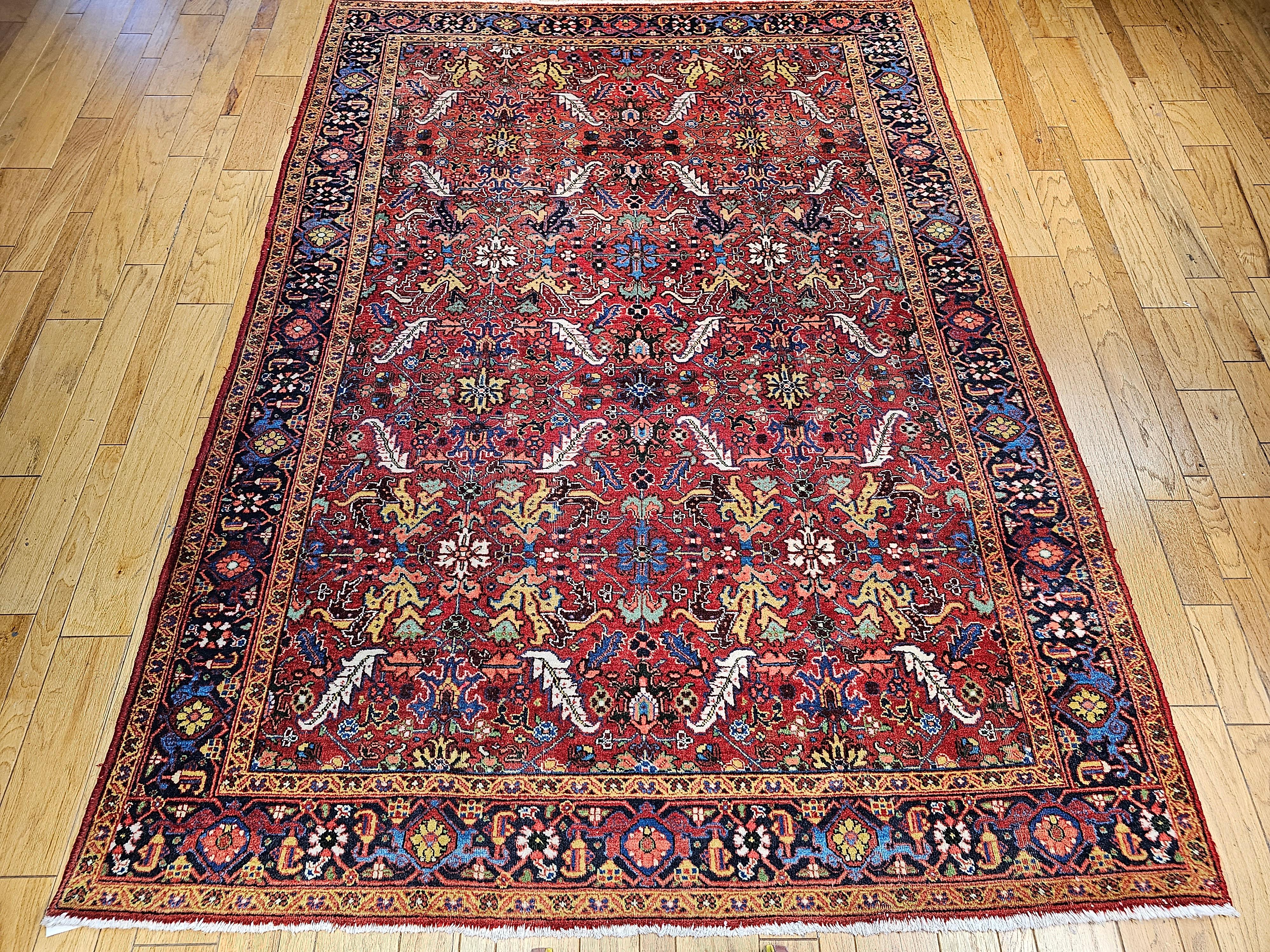  A beautiful vintage Persian Heriz Serapi room size rug from the early 1900s in an allover pattern.  The beautiful and colorful vintage Heriz is in an allover pattern which makes this an extremely desirable room-size rug. The madder color field with