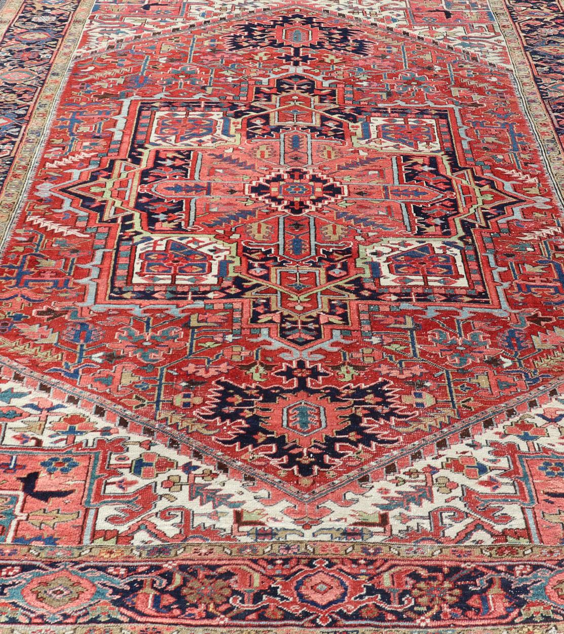 Hand-Knotted Antique Persian Heriz with Central Medallion Design in Red and Jewel Tones  For Sale