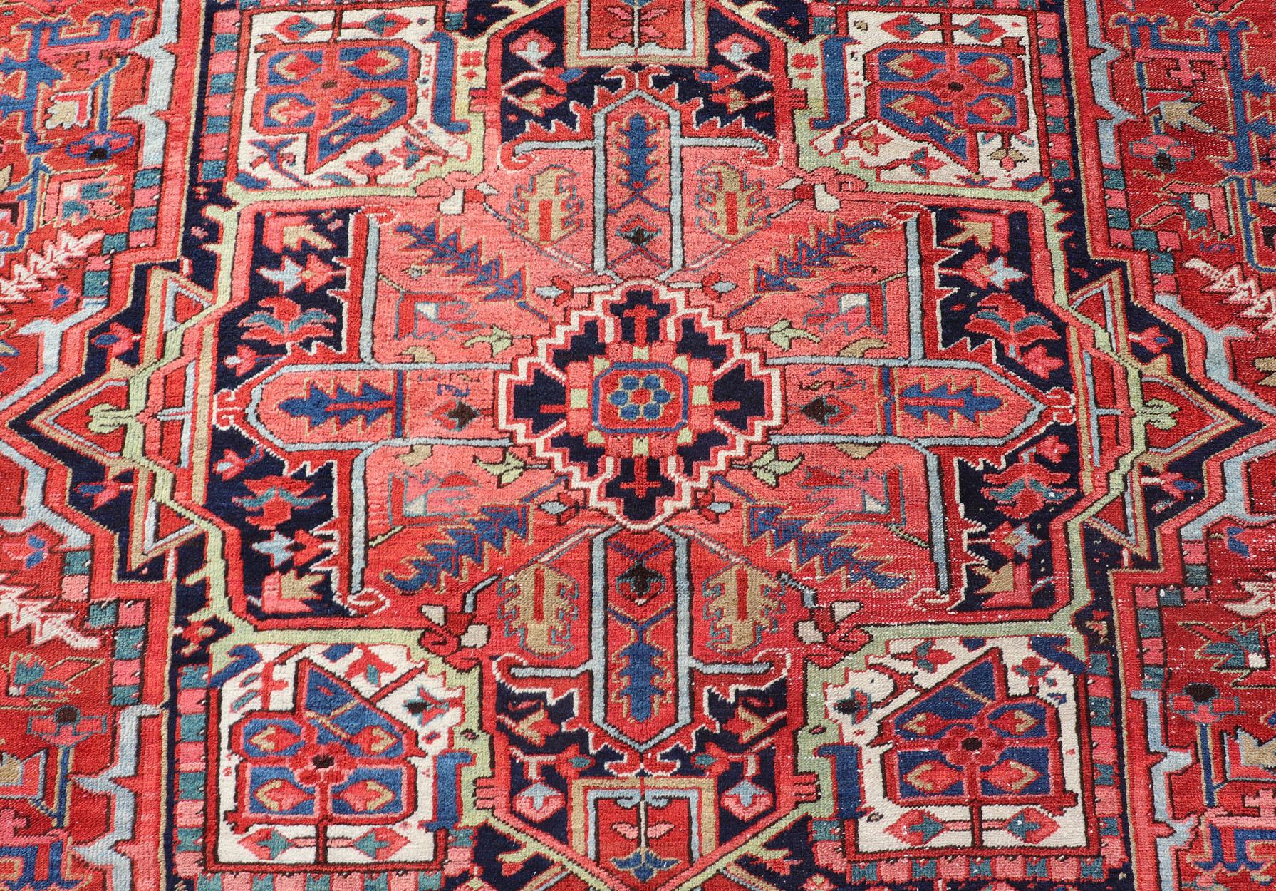 20th Century Antique Persian Heriz with Central Medallion Design in Red and Jewel Tones  For Sale