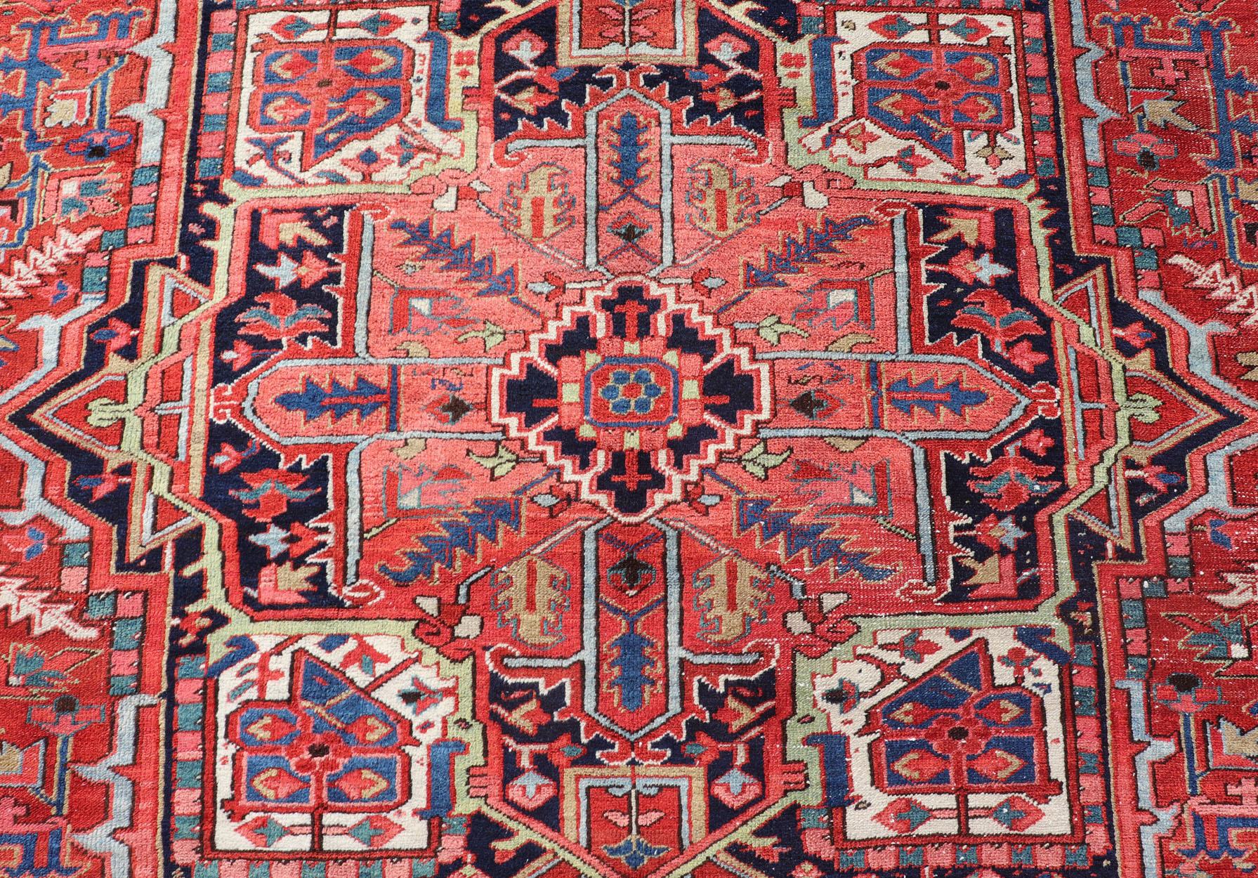 20th Century Antique Persian Heriz with Central Medallion Design in Red and Jewel Tones For Sale
