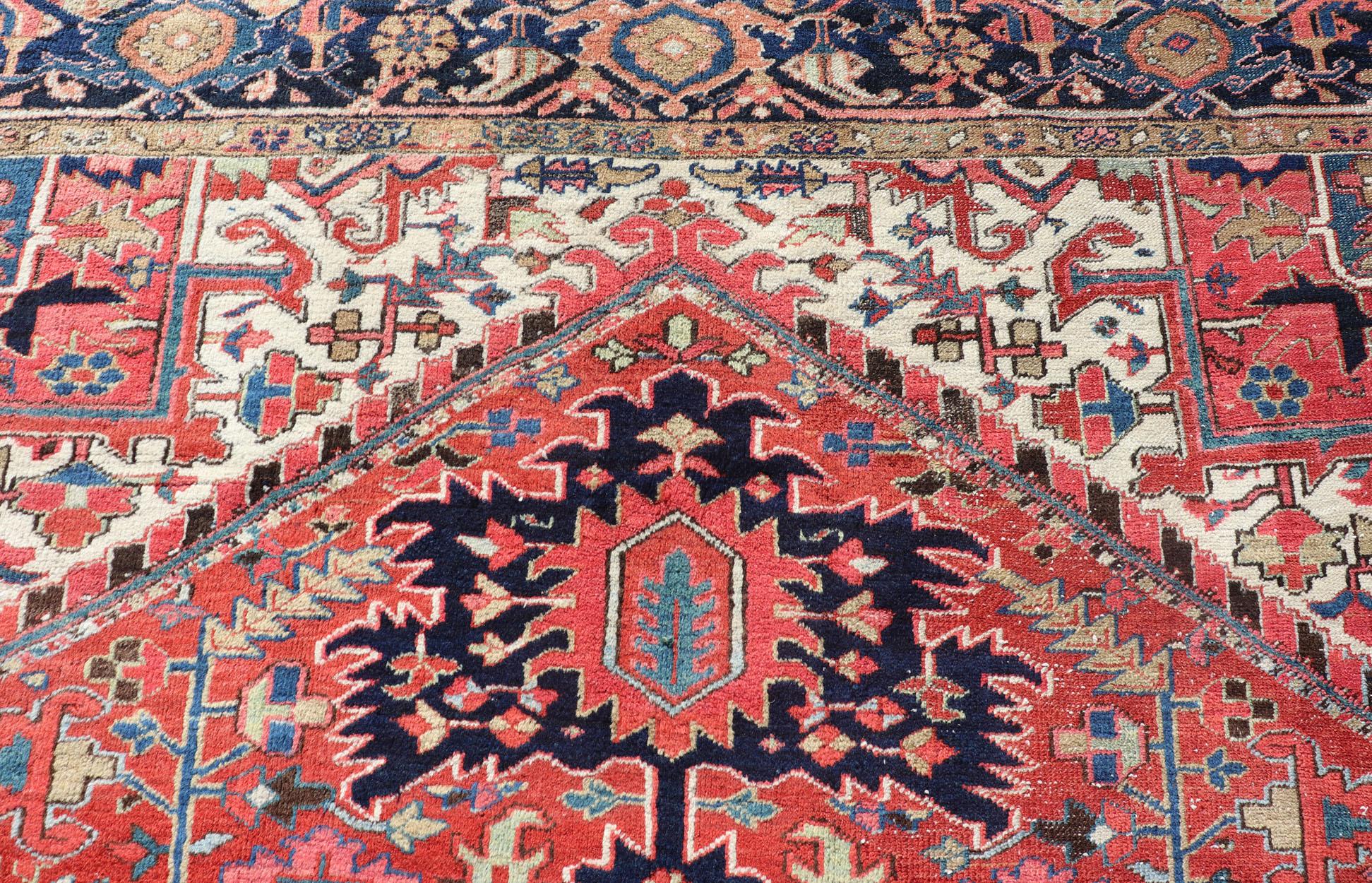 Wool Antique Persian Heriz with Central Medallion Design in Red and Jewel Tones  For Sale