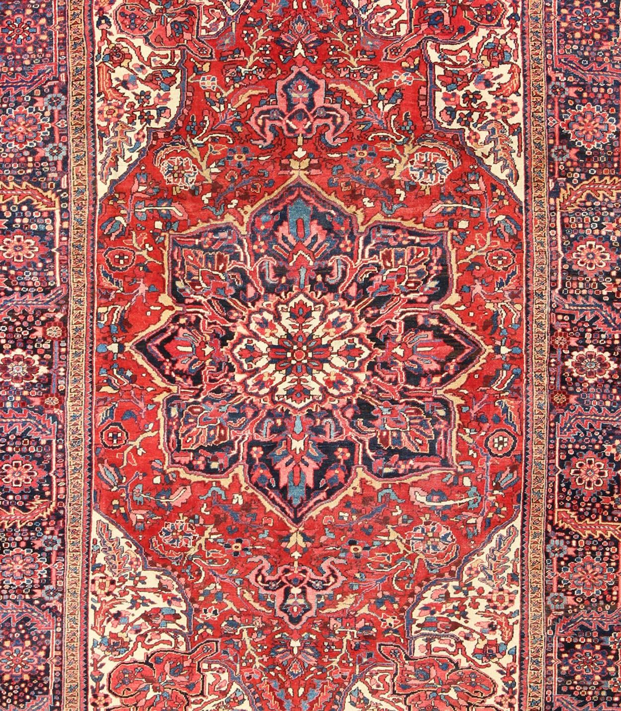 Hand-Knotted Vintage Persian Heriz with Large Medallion in Beautiful Red and Blue For Sale