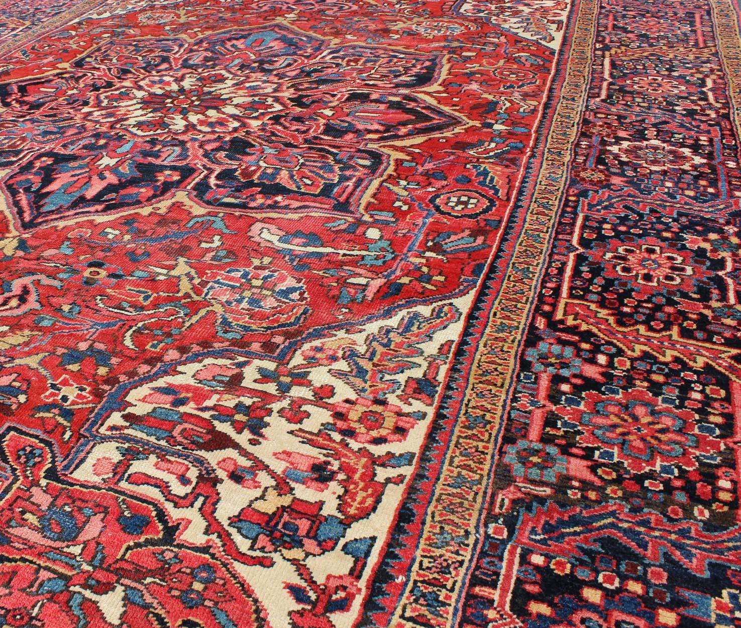 20th Century Vintage Persian Heriz with Large Medallion in Beautiful Red and Blue For Sale