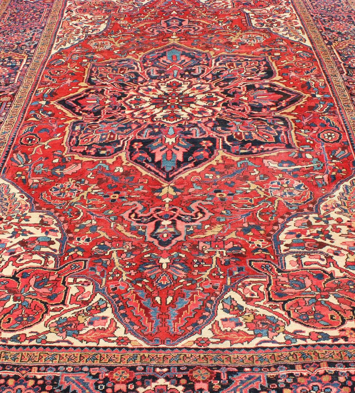 Wool Vintage Persian Heriz with Large Medallion in Beautiful Red and Blue For Sale