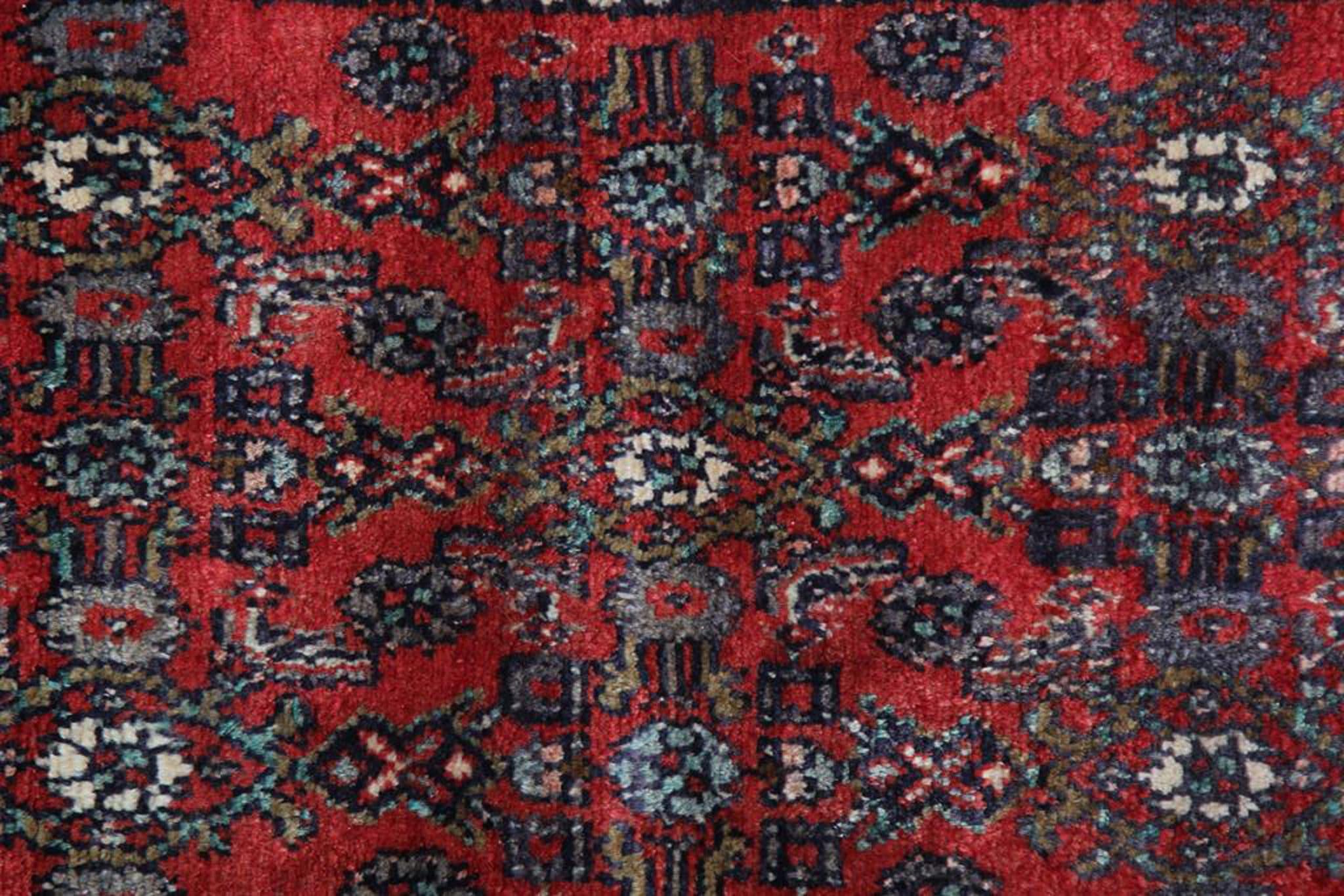 Step into a world of enduring beauty and cultural richness with our vintage Oriental runner rug, a stunning testament to the artistry and heritage of rug weaving. This handcrafted rug embodies centuries of tradition and craftsmanship. Crafted in the