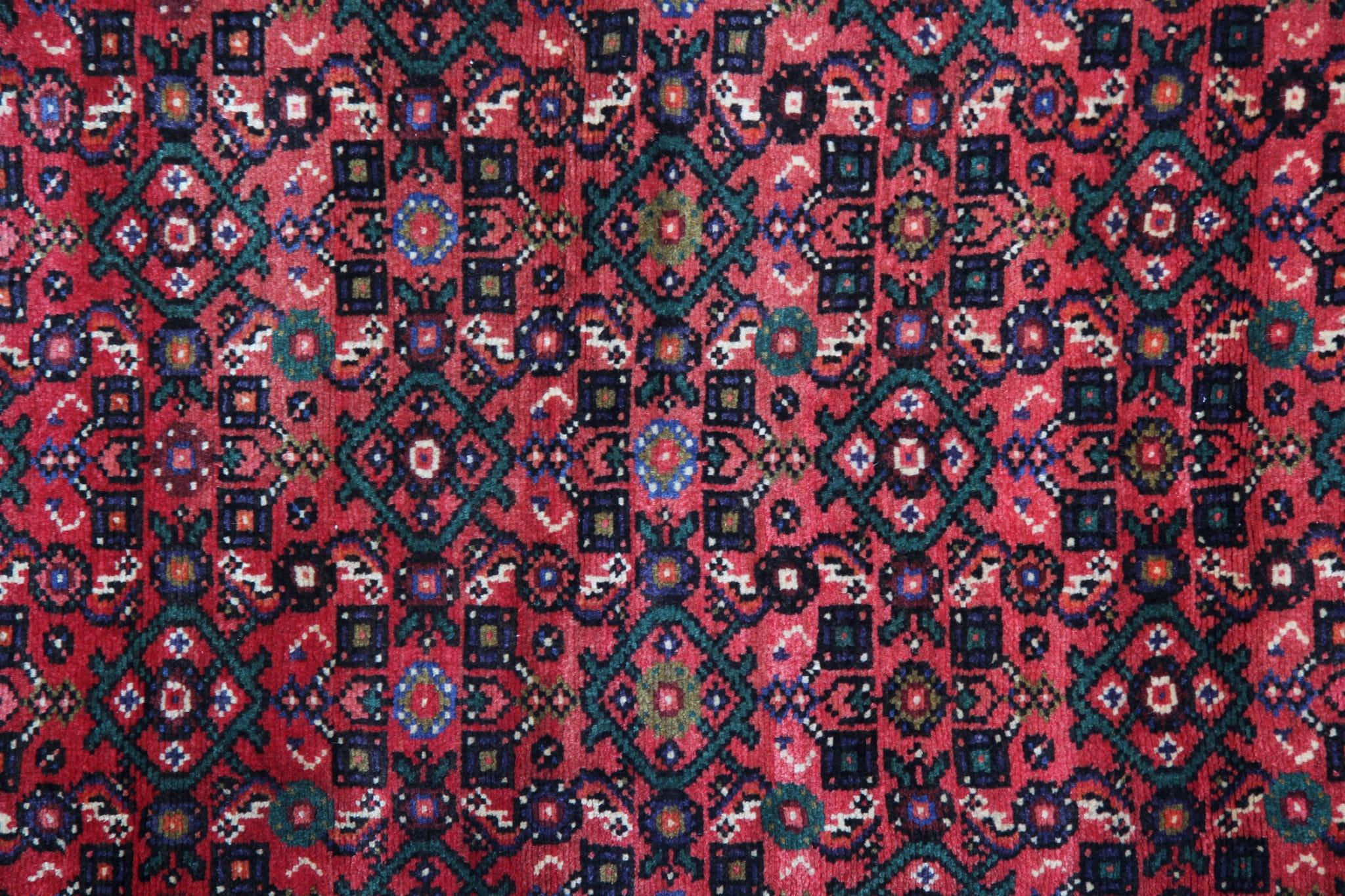 This gorgeous handmade carpet wool runner rug has been beautifully handwoven in stunning red, deep blue and subtle creams. Delicate designs of rustic and traditional patterns are woven throughout, a deep red all over design in this long stair