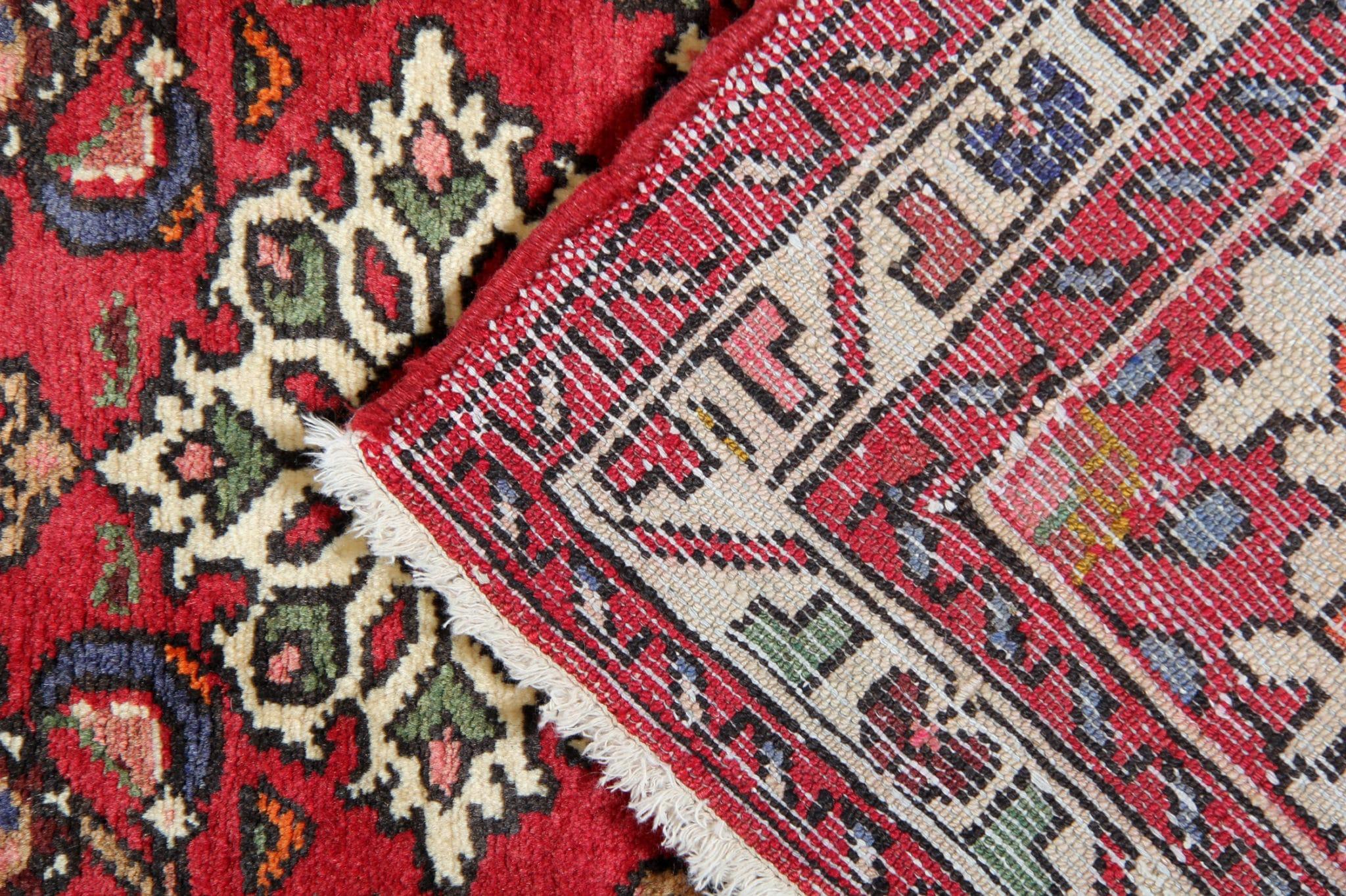 An exquisite vintage runner rug handcrafted with care and precision. This rug epitomizes the artistry and craftsmanship of oriental rug making, showcasing the rich heritage of the region. These carpets are made of all organic material including hand