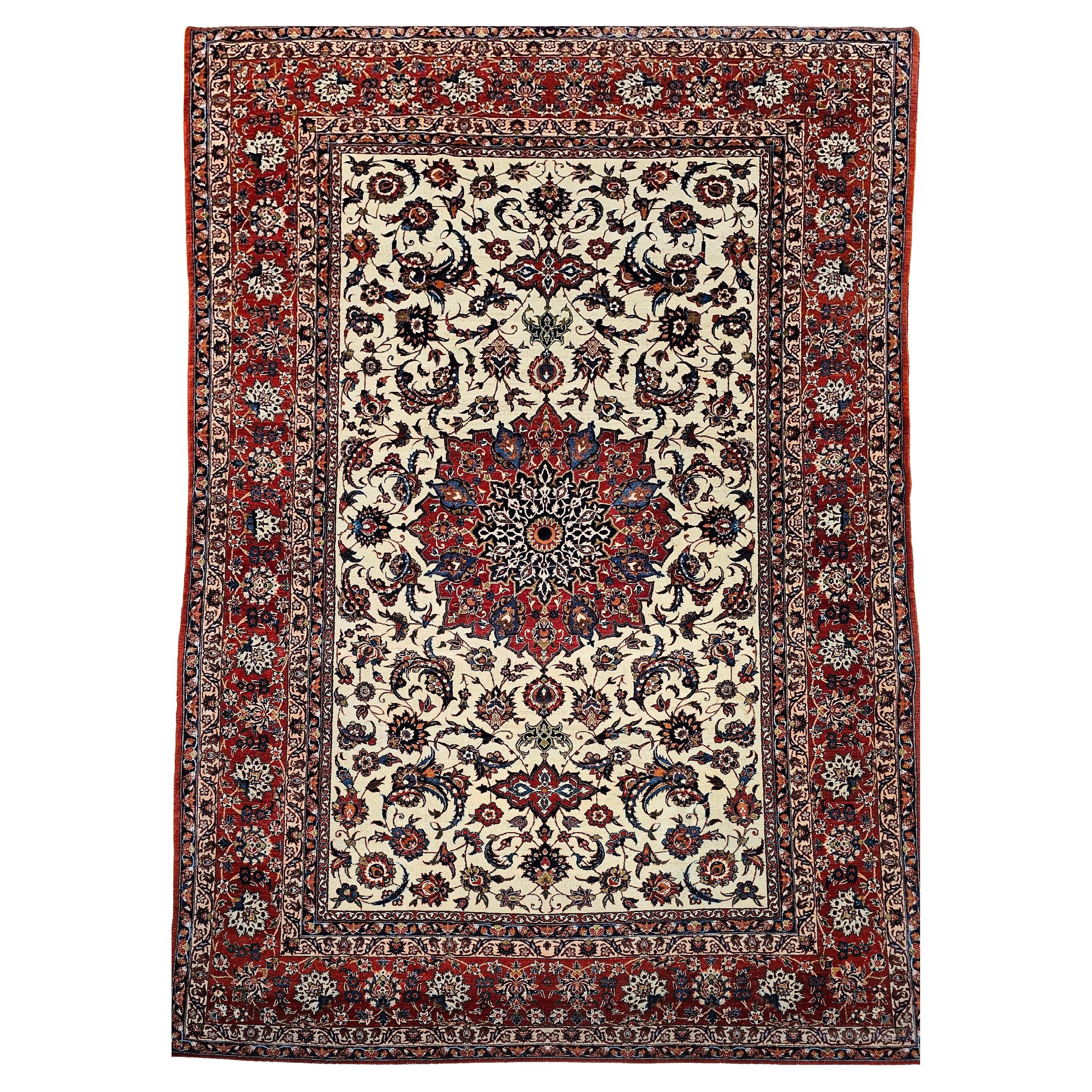 Alfombra persa vintage Isfahan con motivos florales en marfil, rojo y azul