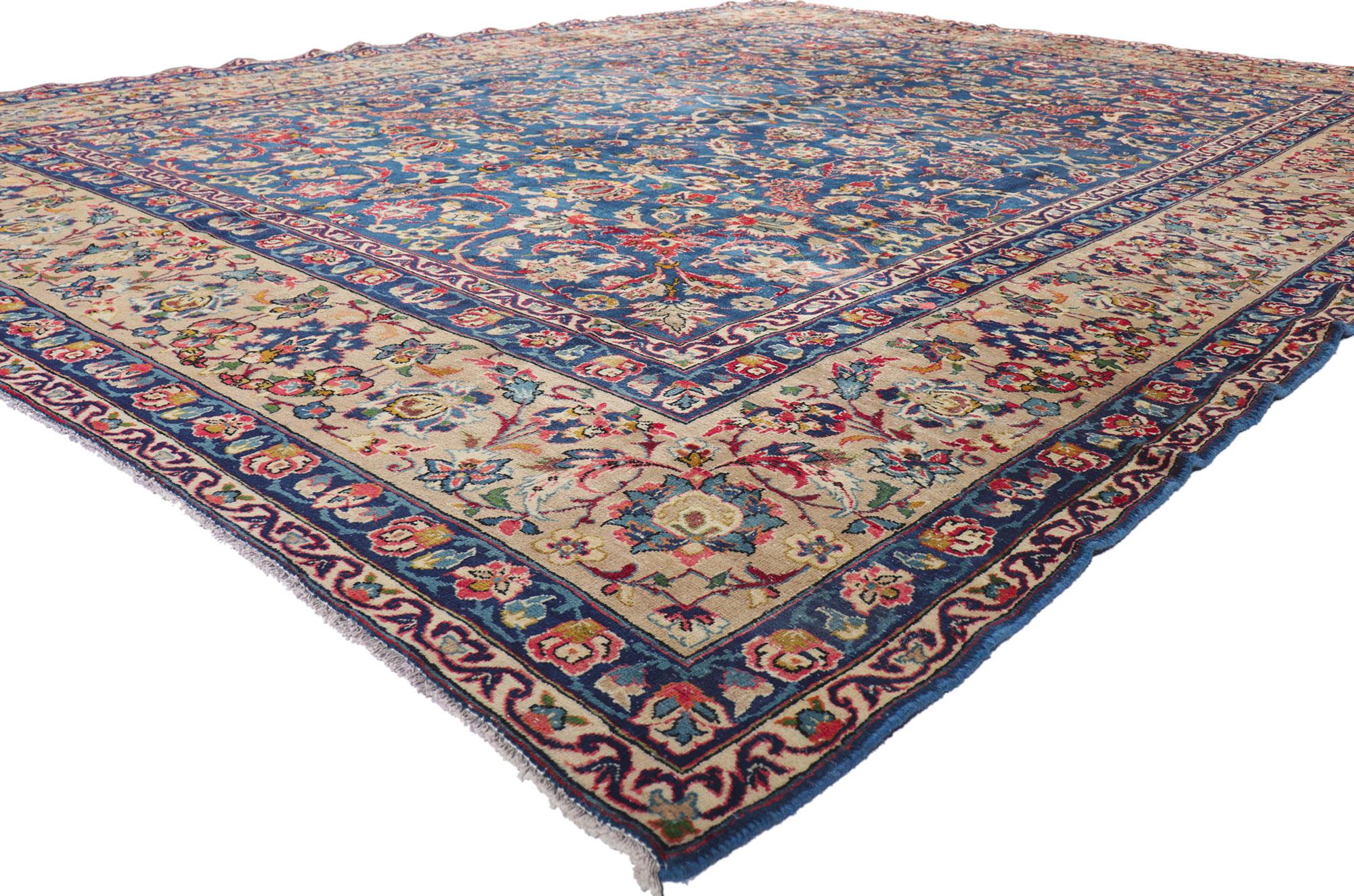 61207 Vintage Persian Isfahan rug, 09'10 x 13'00.
With its effortless beauty and timeless design, this hand-knotted wool vintage Persian Isfahan rug is poised to impress. The abrashed blue field features an allover botanical pattern composed of
