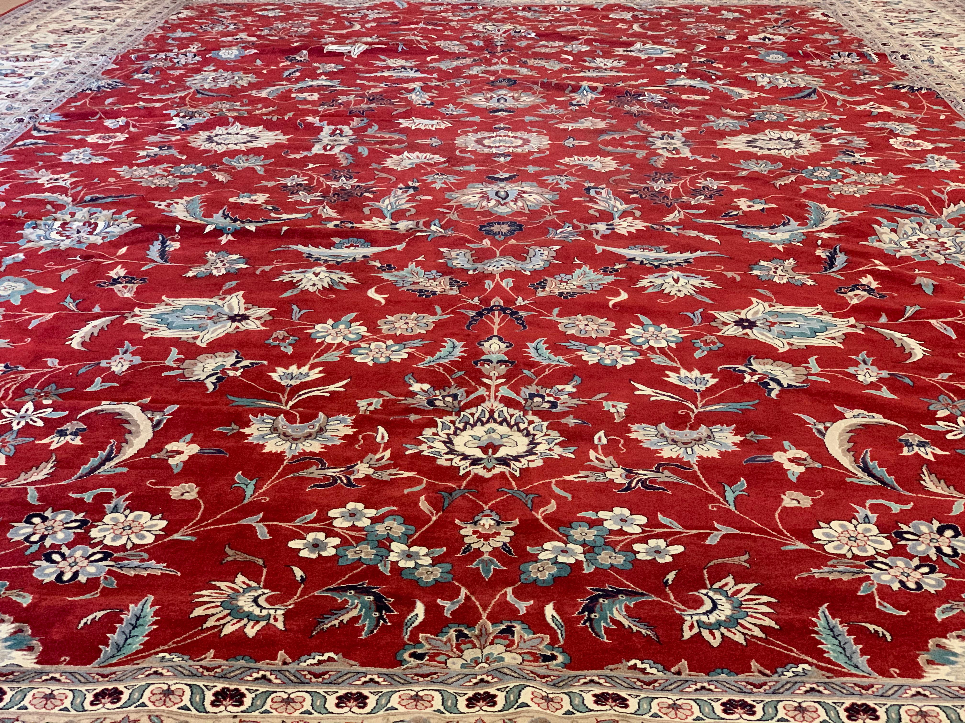 This is a vintage hand-knotted Isfahan Rug, made in central Persia circa 1950s, in excellent condition for its age. It is wool knots on cotton warp and weft, and has an incredibly fine knot count. The rug is signed, and is approximately 12 x 18.5