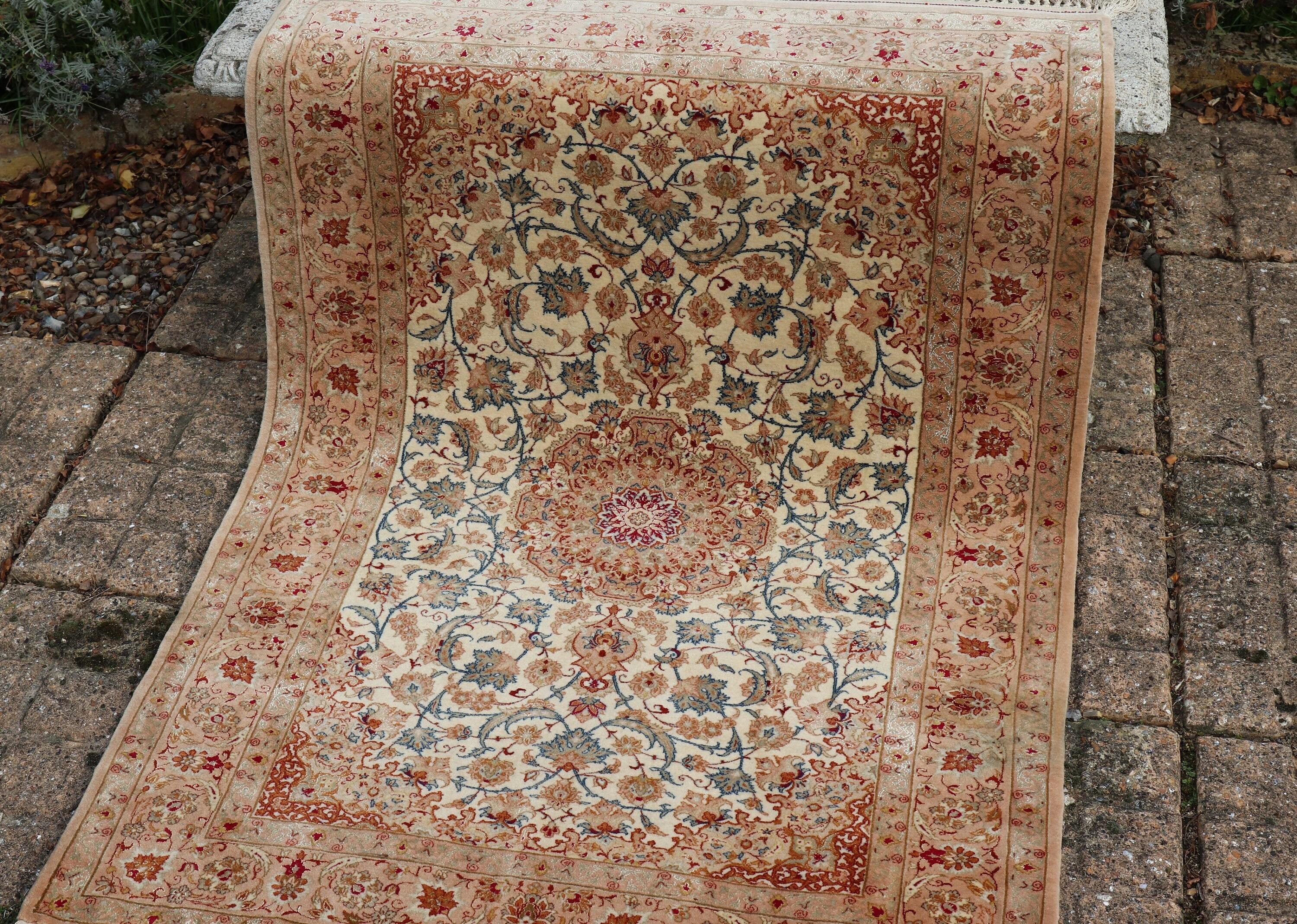 Mid Century Hand Knotted Persian Rug
Made in the region of Isfahan

Wool with Silk highlights

Good vintage condition minor wear to one corner (see photograph)

SIZE  39 inches x 58 inches