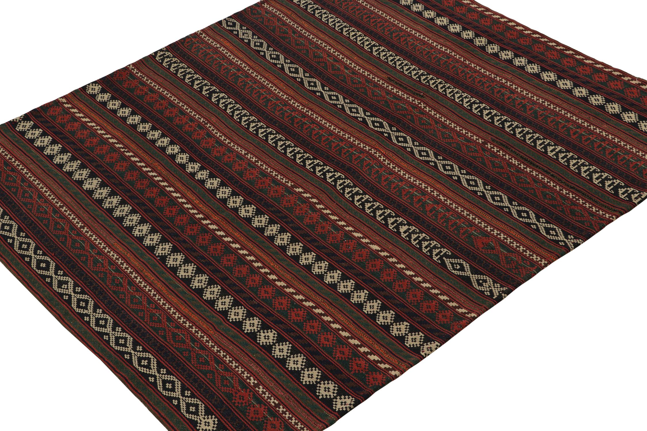 This vintage 6x7 Persian Kilim is a tribal rug of Jajim provenance. Handwoven in wool, it originates circa 1950-1960. 

Further On the Design: 

This Jajim Kilim design exemplifies the panel-weaving style its provenance favors, and plays stripes