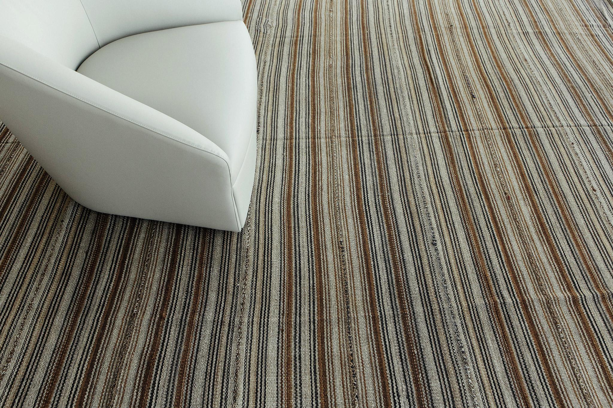 This rug features slightly varying degrees of stripes that also vary in their concentration and thickness. Its simple design allows it to easily fit into a variety of interiors.

Rug Number 26763
Size 9' 10