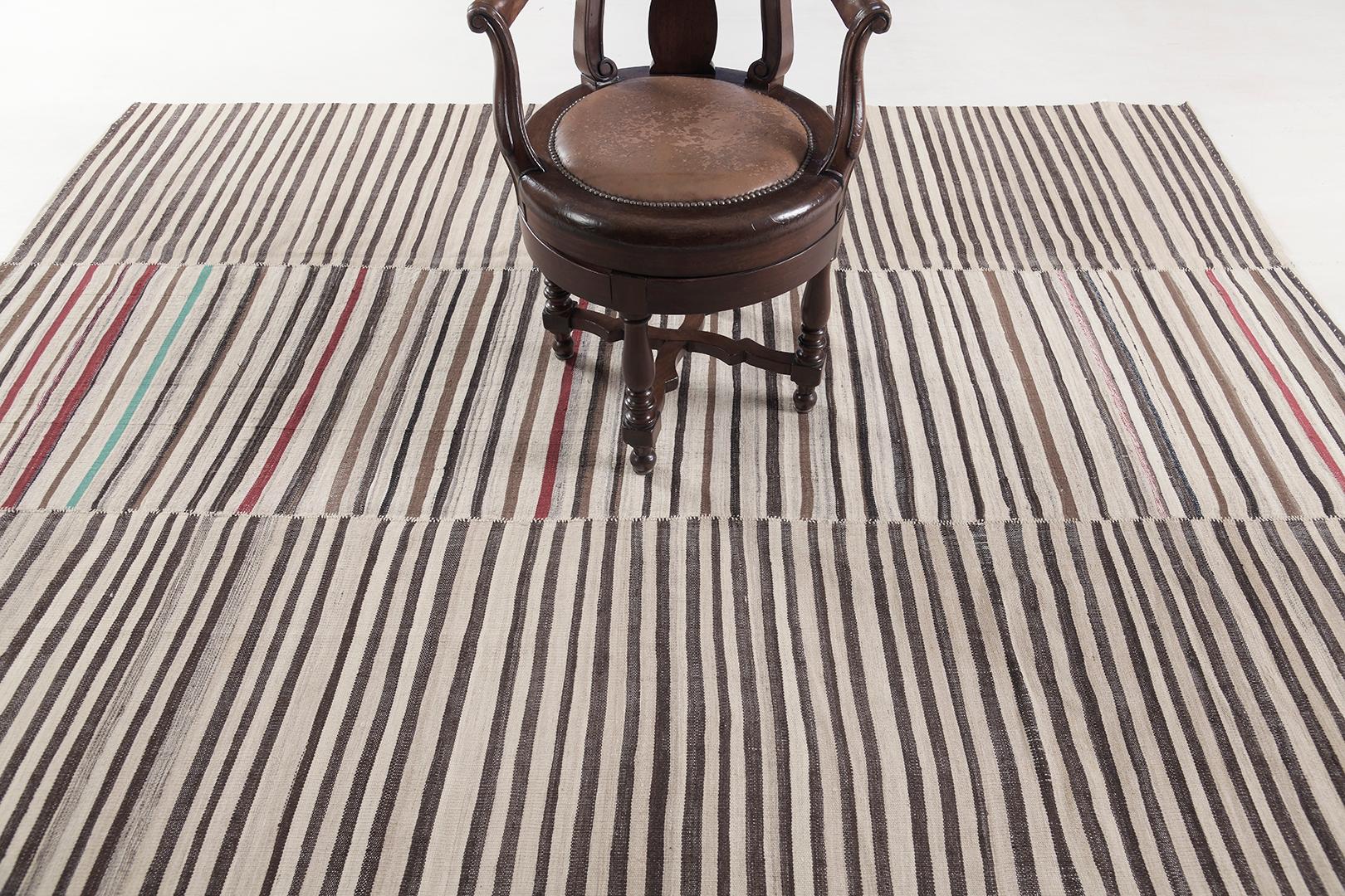 This Persian Jejim Kilim is a banded flat weave with alternating hues of green, red, ivory, khaki, and clay brown in multi-column stripes. Persian flatweaves are made up of some of the best wool and weaved exceptionally to create interesting