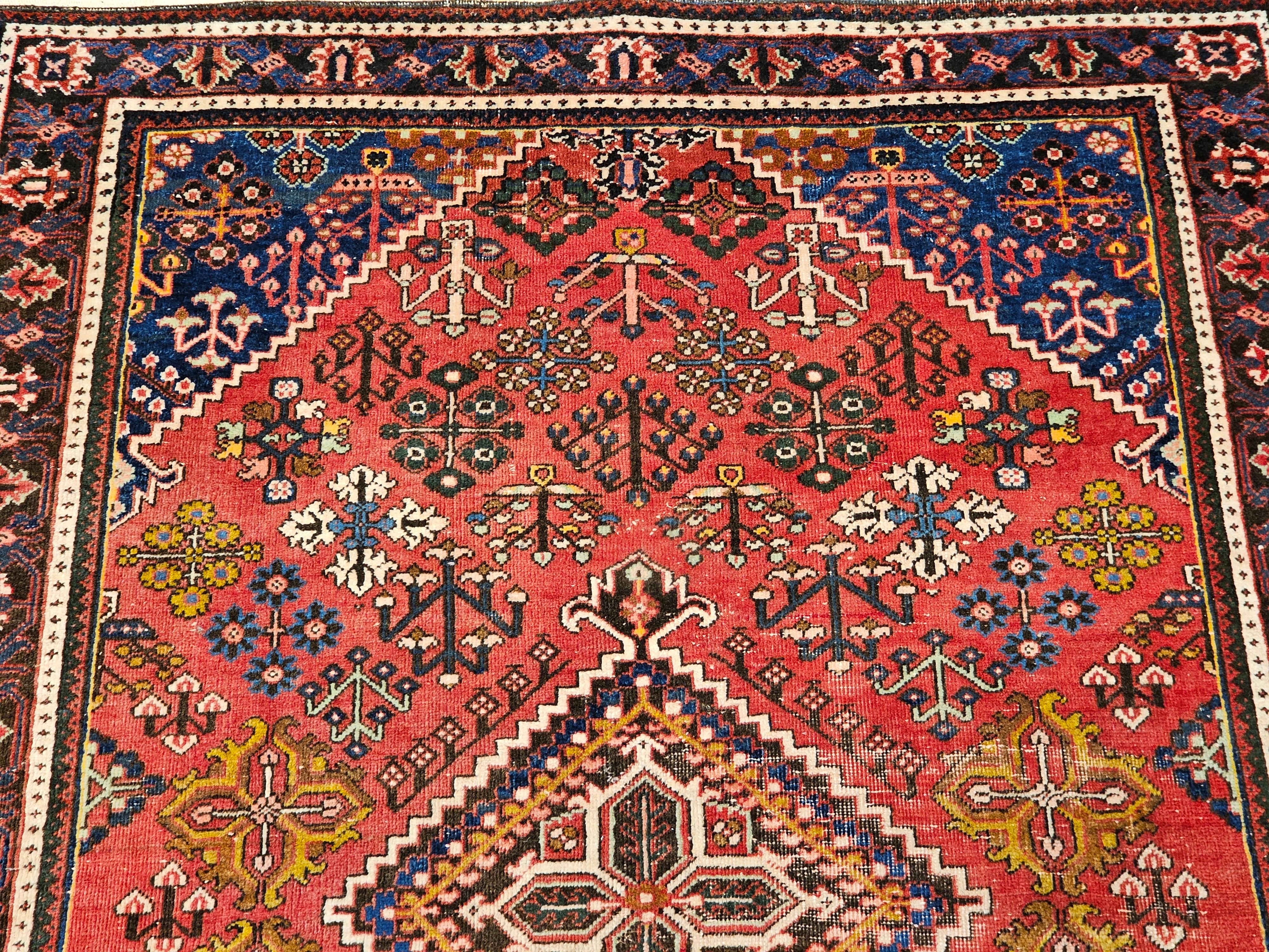 Wool Vintage Persian Joshaghan Rug in a Geometric Pattern in Rust Red, French Blue, G For Sale