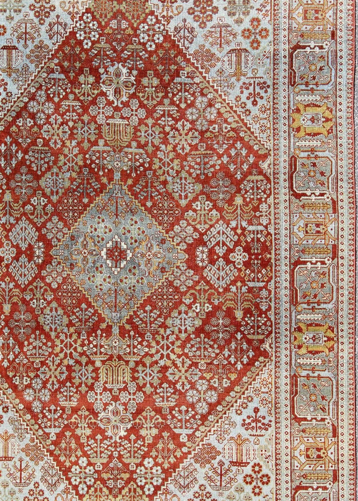 Tribal Antique Persian Joshegan Rug with Geometric Medallion Design in Rust and Ivory For Sale