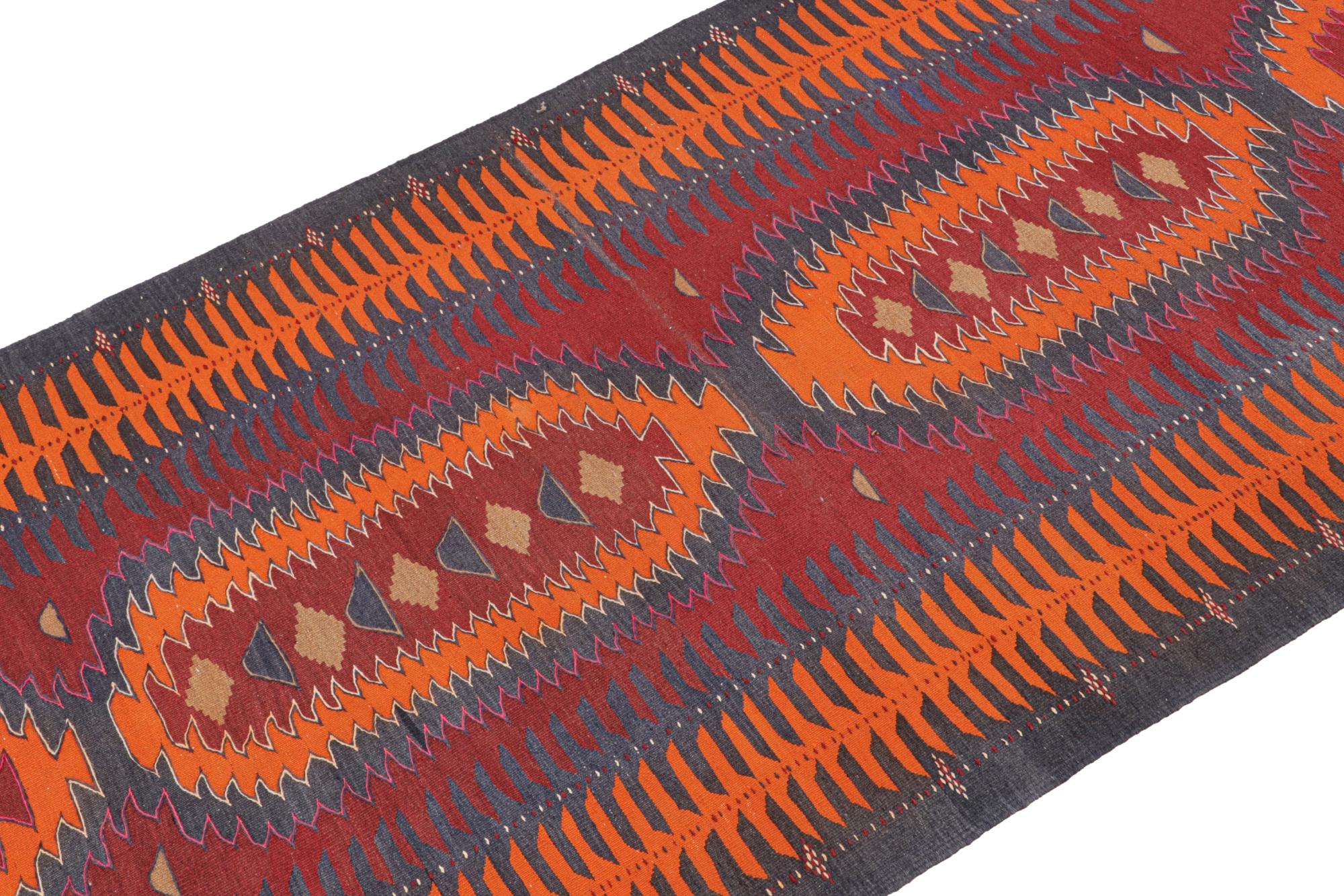 This rare vintage 5x14 Persian Kilim is a tribal Karadagh rug — named after the mountainous region known for its fabulous works. Handwoven in wool, it originates circa 1950-1960.

On the Design: 

The gallery runner carries interesting orange-