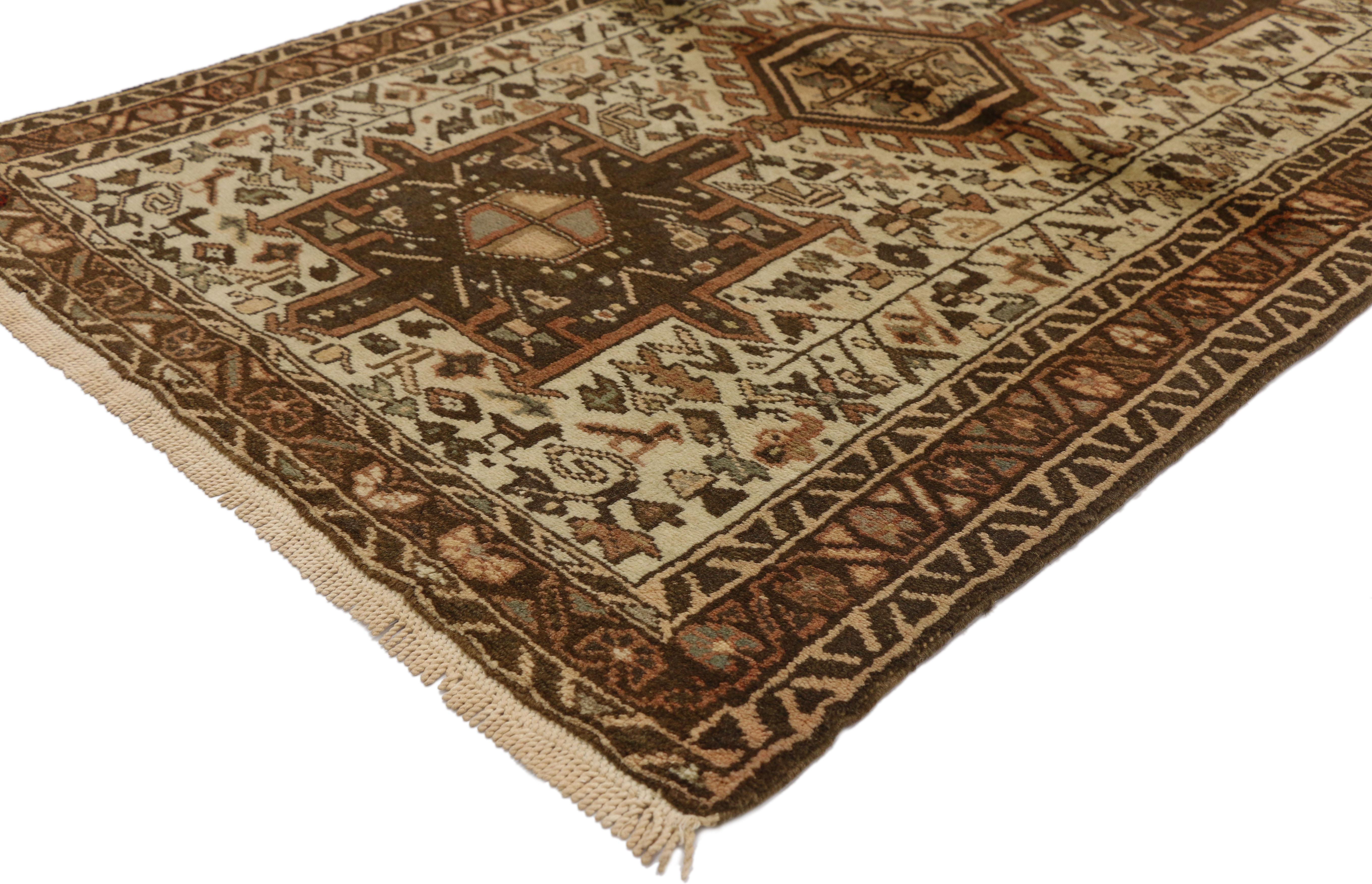 60331 Vintage Persian Karaja Heriz Accent rug with Mid-Century Modern style. This hand knotted wool vintage Persian Heriz Karaja rug features a latch-hook octogram amulet flanked by two square cruciform medallions surrounded by symbolic geometric