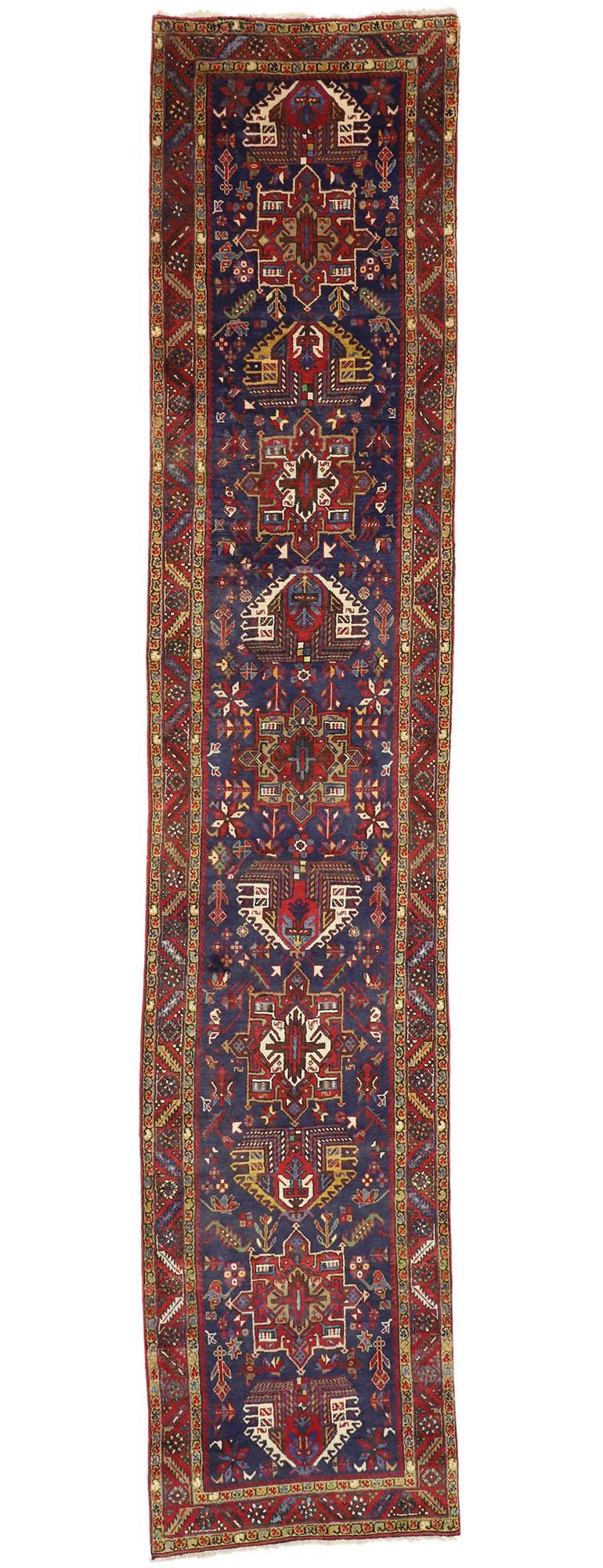 60252 Vintage Persian Karaja Heriz Runner, Tribal Style Hallway Runner 03'01 x 14'07. Bright and dynamic with visual appeal, this hand knotted wool vintage Persian Karaja Heriz runner features a column of distinctive medallions and amulets similar
