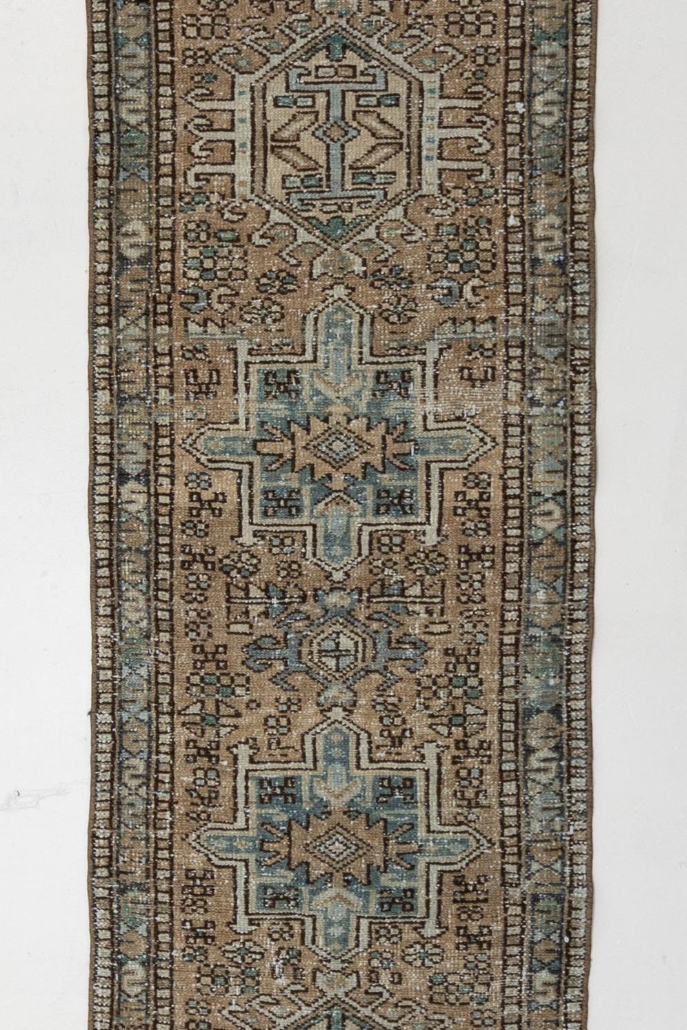 Age: Circa 1940

Colors: tan, blue, brown, black, teal

Pile: low

Wear Notes: 2

Material: Wool on cotton. 

Early to mid 20th century Persian Karaja with a warm tan field and blue medallions that are symbolic of regional insects and foliage.