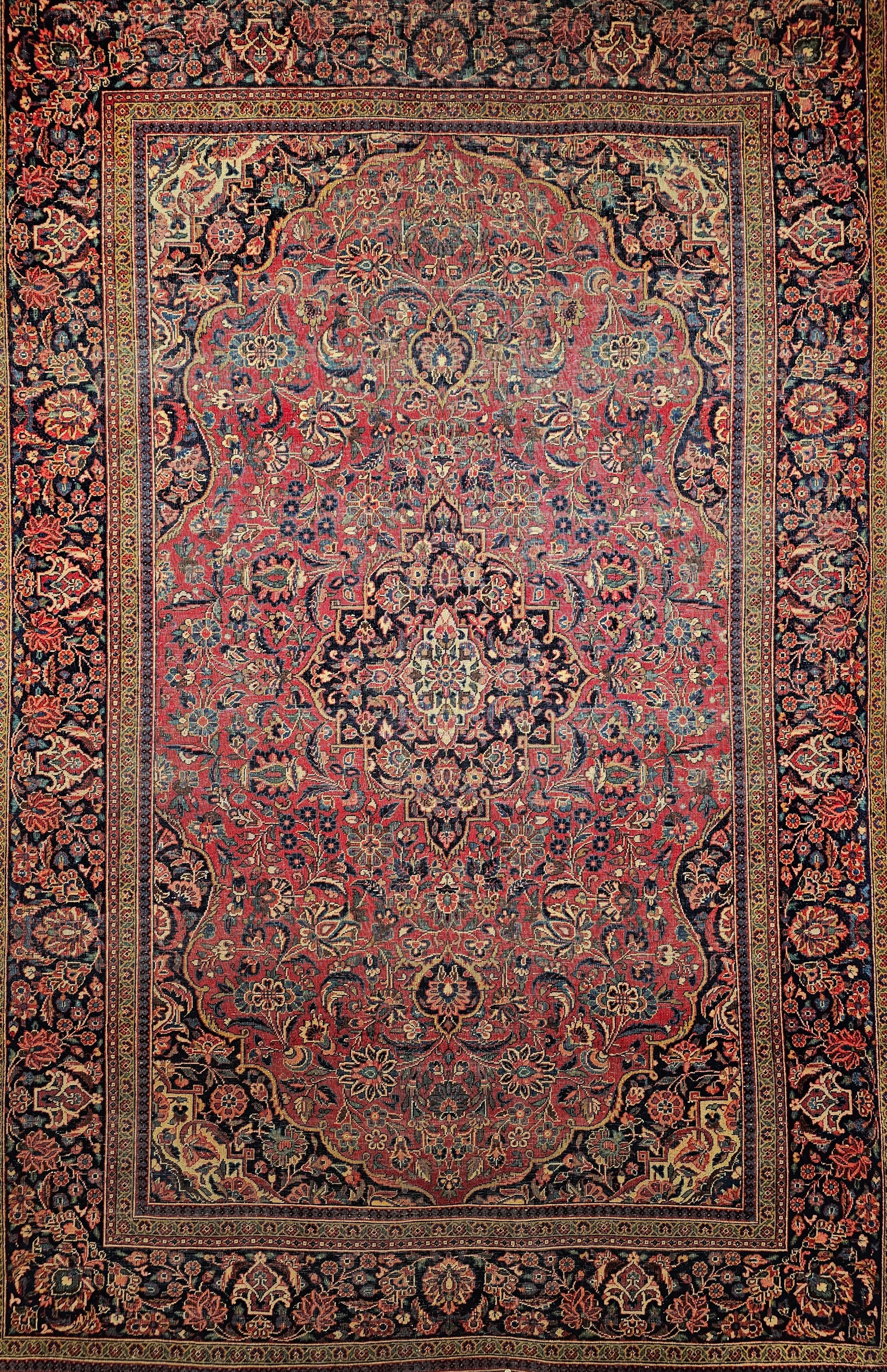 Vintage Persian Kashan area rug in Floral pattern in burgundy and navy Blue.  The classical design and luminous, resilient wool quality of this outstanding vintage Persian Kashan carpet create an impression of consummate refinement. This Kashan rug