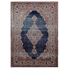 Tapis persan Kashan du début des années 1900 en bleu marine, ivoire, rouge, vert et brun clair