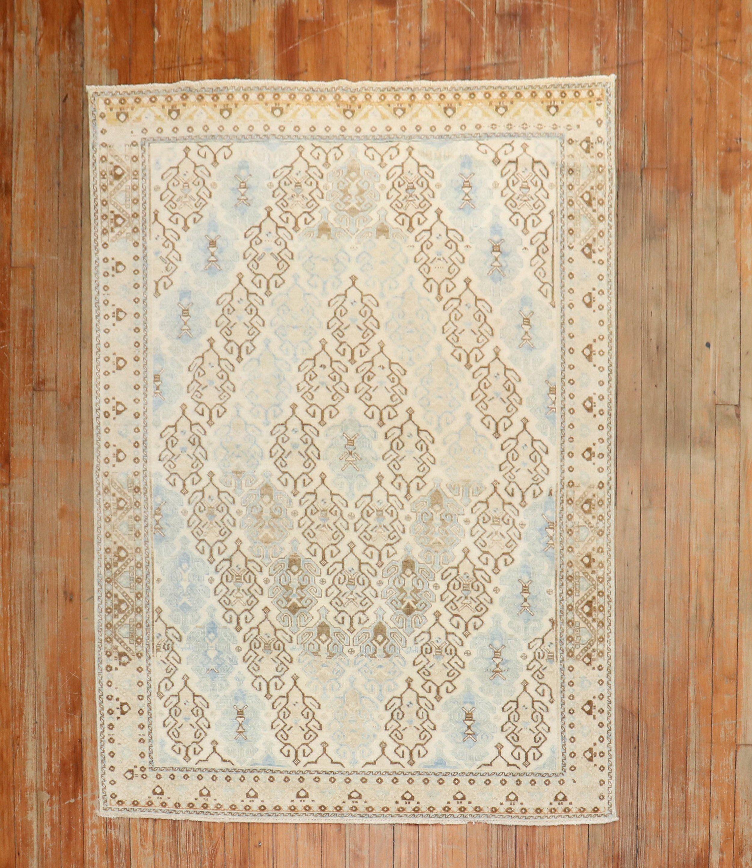 A mid 20th century Persian Kashan rug in beige, bnrown and baby blue.

Measures: 4'1'' x 5'6''.