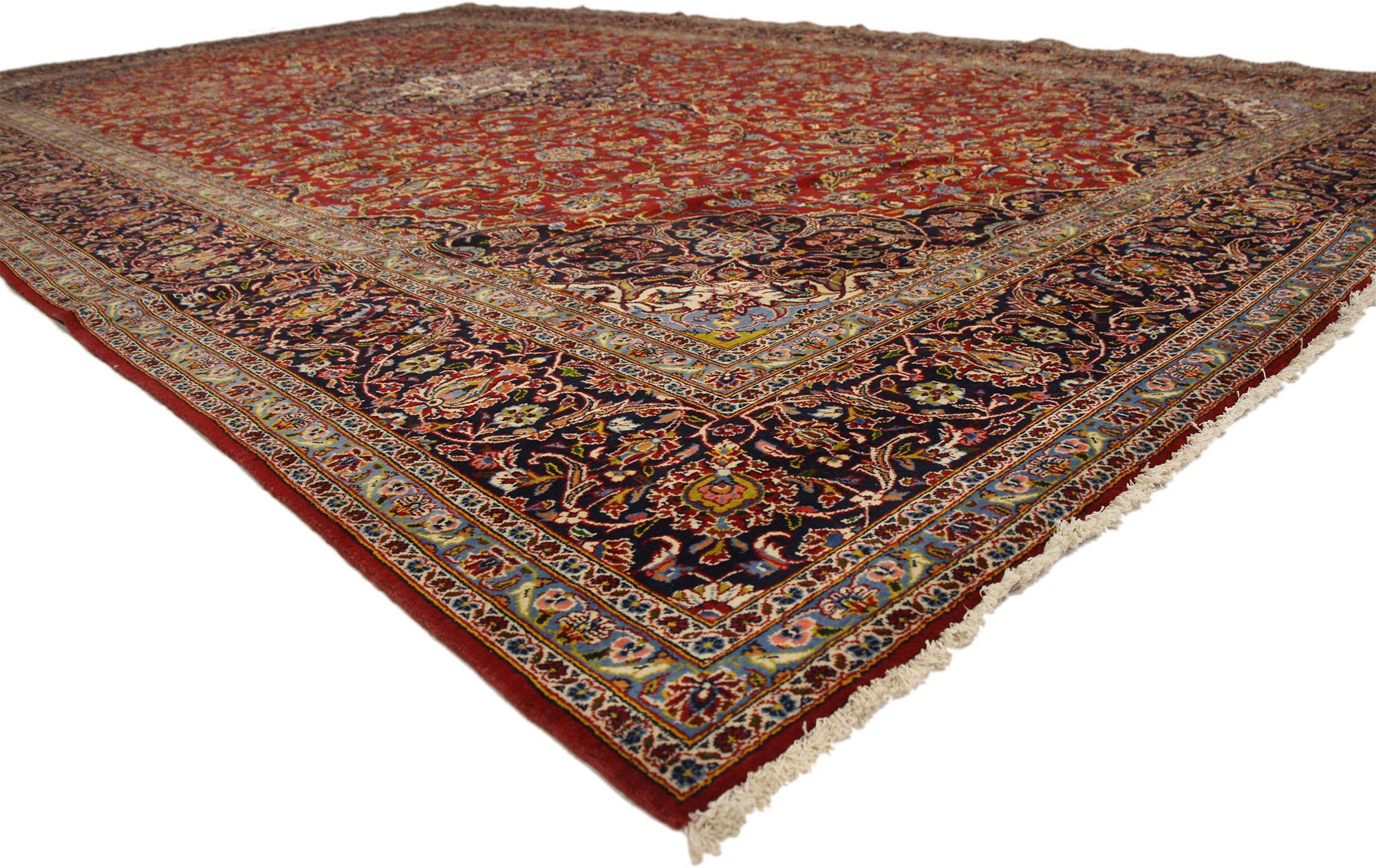 76210 Vintage Persian Kashan Rug, 10'06 x 17'01. 
Emanating a timeless design and beguiling beauty, this hand-knotted wool vintage Persian Kashan rug is poised to impress. The abrashed red field features a round lobed floral medallion surrounded by