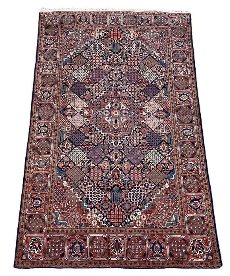 A beautiful vintage Kashan rug, handwoven circa 1950 with a geometrical design on a deep indigo field and great secondary colours. Finely woven with lovely wool quality.
Size: 2.20m x 1.35m (7ft 3in x 4ft 5in)
This rug is in good condition with