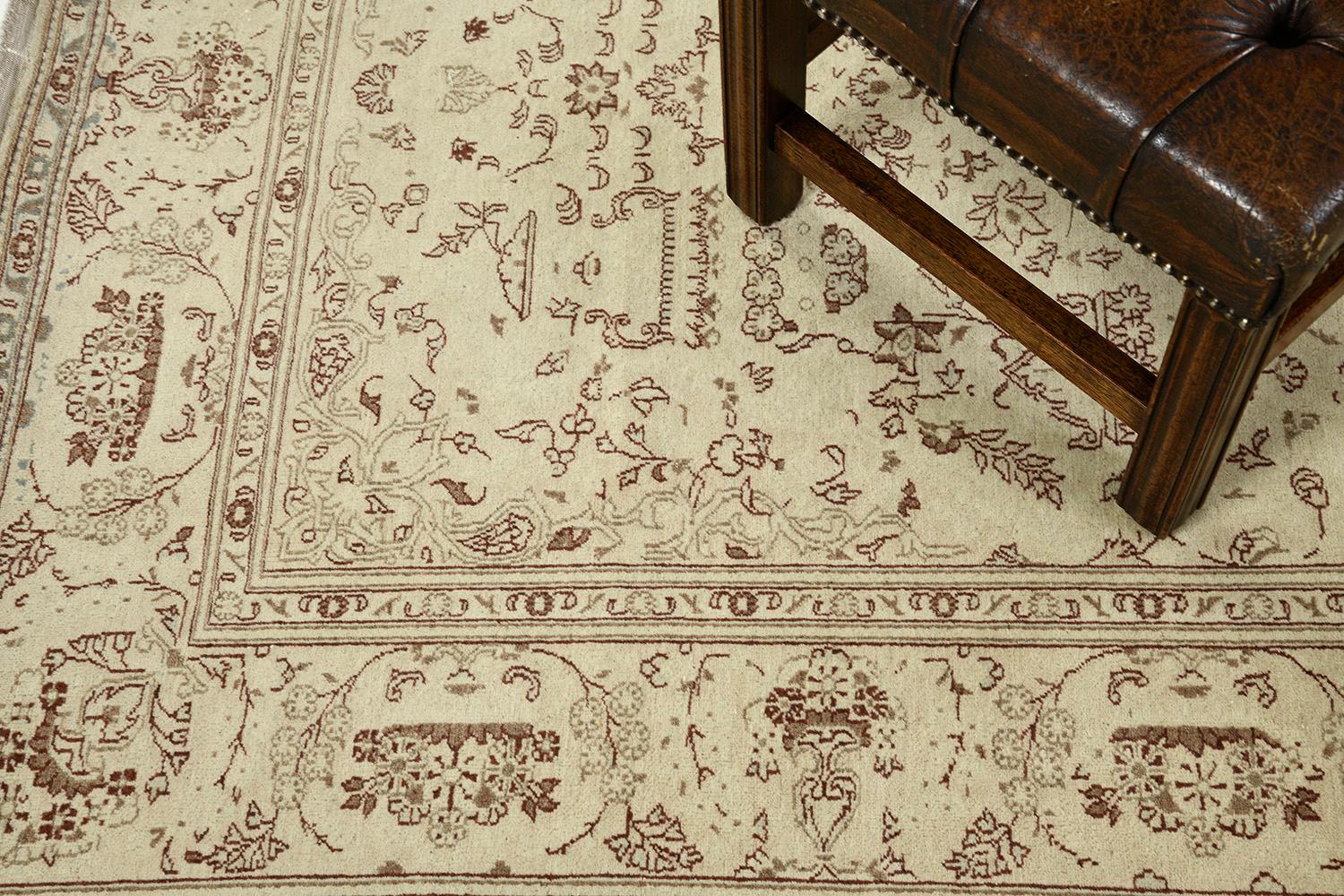 An impressive creation of the Kashan rug that features a penny-worth impact from its every design. At its core, majestically presents a detailed medallion-shaped floral theme, symbolic motifs, and leafy scrolls. An effortless combination of various
