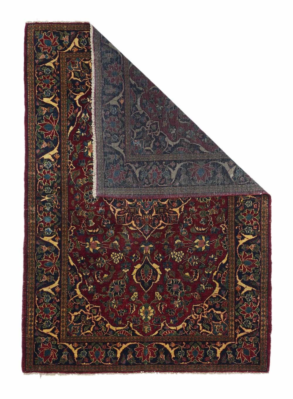 Vintage Persian Kashan Rug 4'6'' x 6'6''. A navy medallion with eight major arabesque-defined points and acanthus pendants, is set on the darkest wine field alive with palmettes and tripled rosettes. Near black corners with acanthus edges. Near