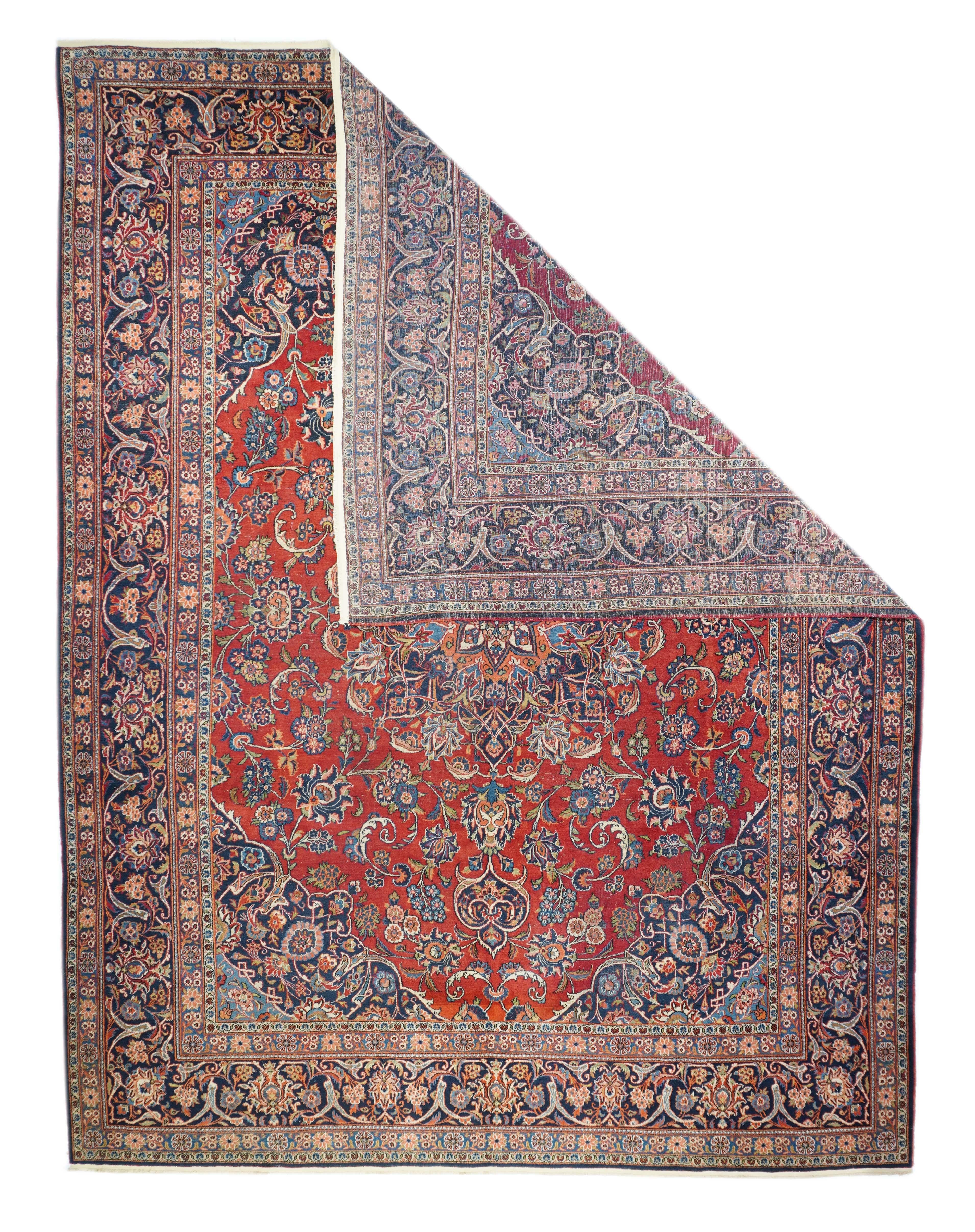 Vintage Persian Kashan Rug 9’8” x 12’6”. Central Persian city known for finely woven. room size and scatter rugs, with dominant reds and navy, and medallion patterns and swirling palmettes. Wool and a few silk pieces. Active since the 16th century,