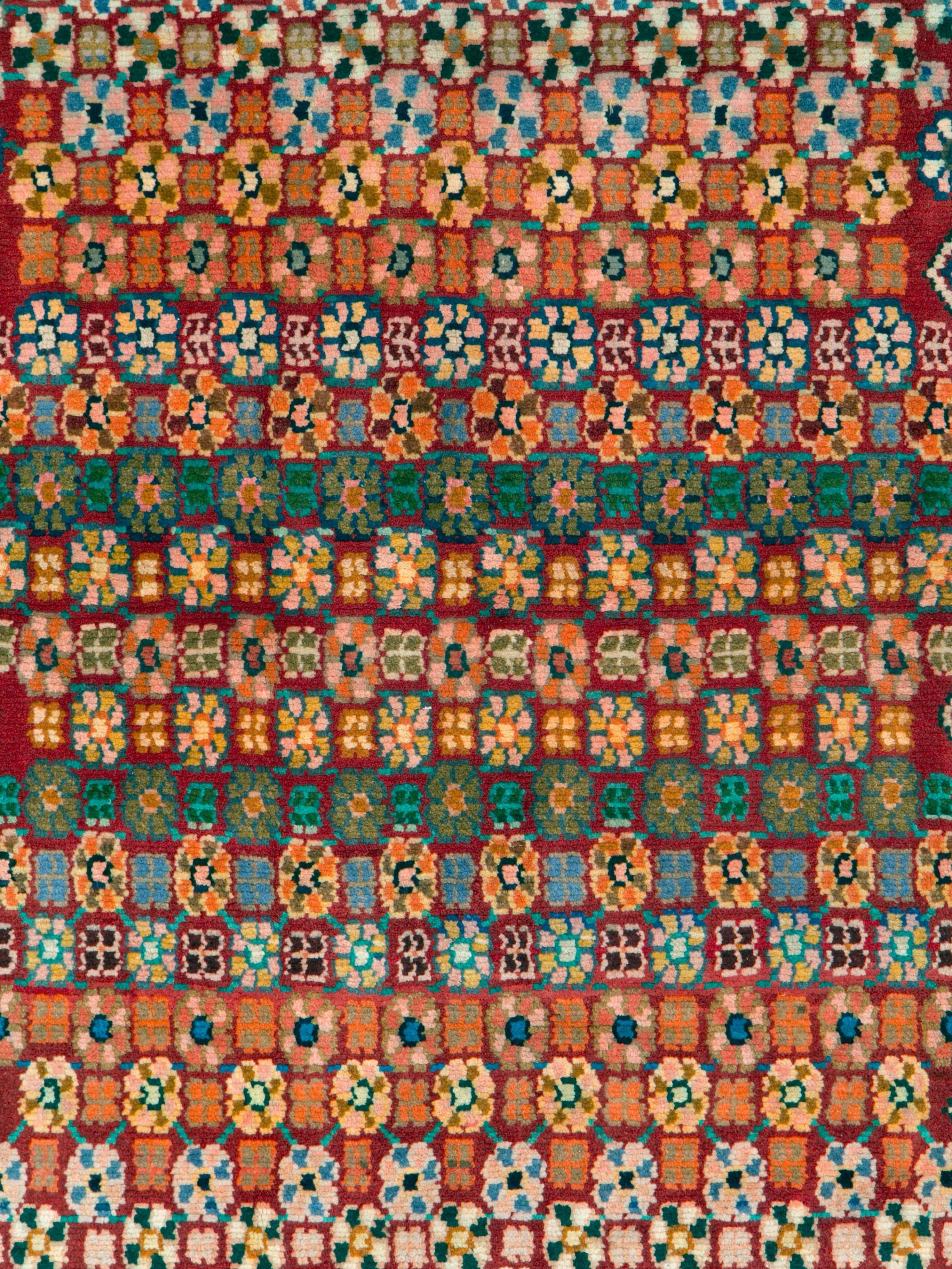 A vintage Persian Kashan rug from the mid-20th century.