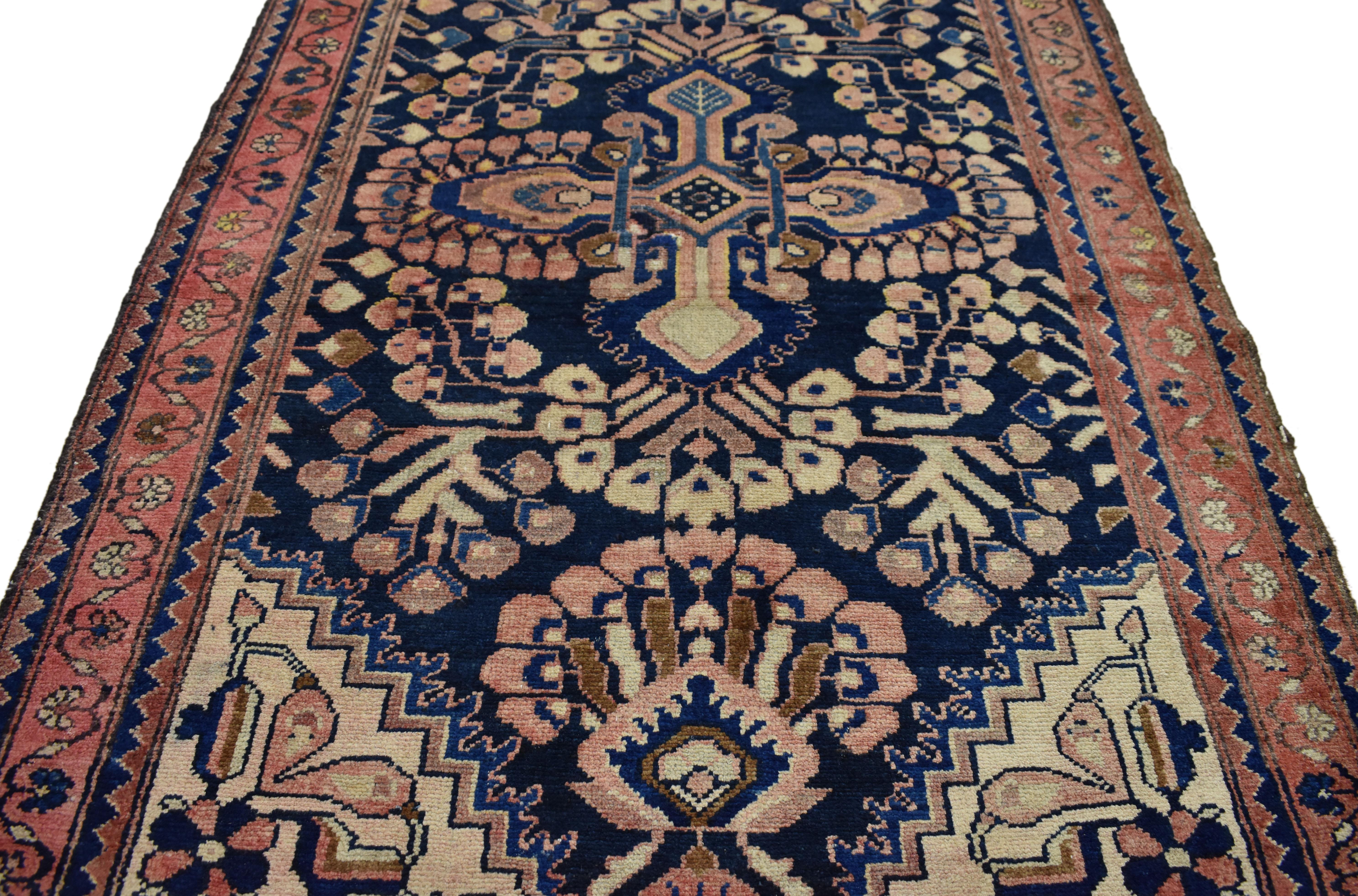 75369, vintage Persian Kasvin Hamadan runner with sarouk design, Hallway runner. This hand-knotted wool vintage Persian Kasvin Hamadan carpet runner with Sarouk design features a bright pink cruciform-style floral pattern on a deep navy-blue field.