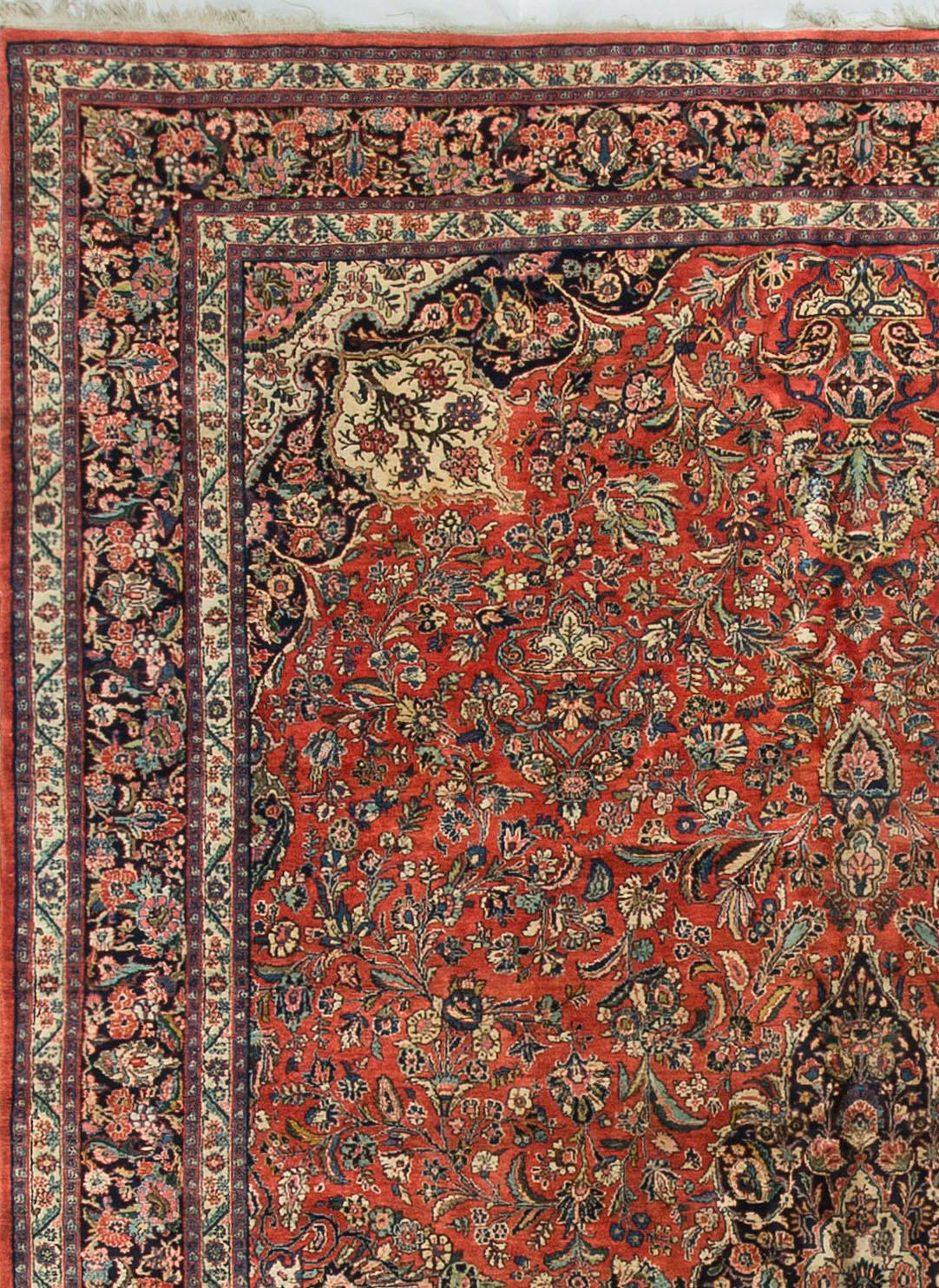 This antique Persian Kazvin rug, dating back to the 1930s, showcases a captivating and detailed design. Kazvin rugs are known for their intricate patterns, often featuring geometric motifs and stylized floral elements. The central field of this rug