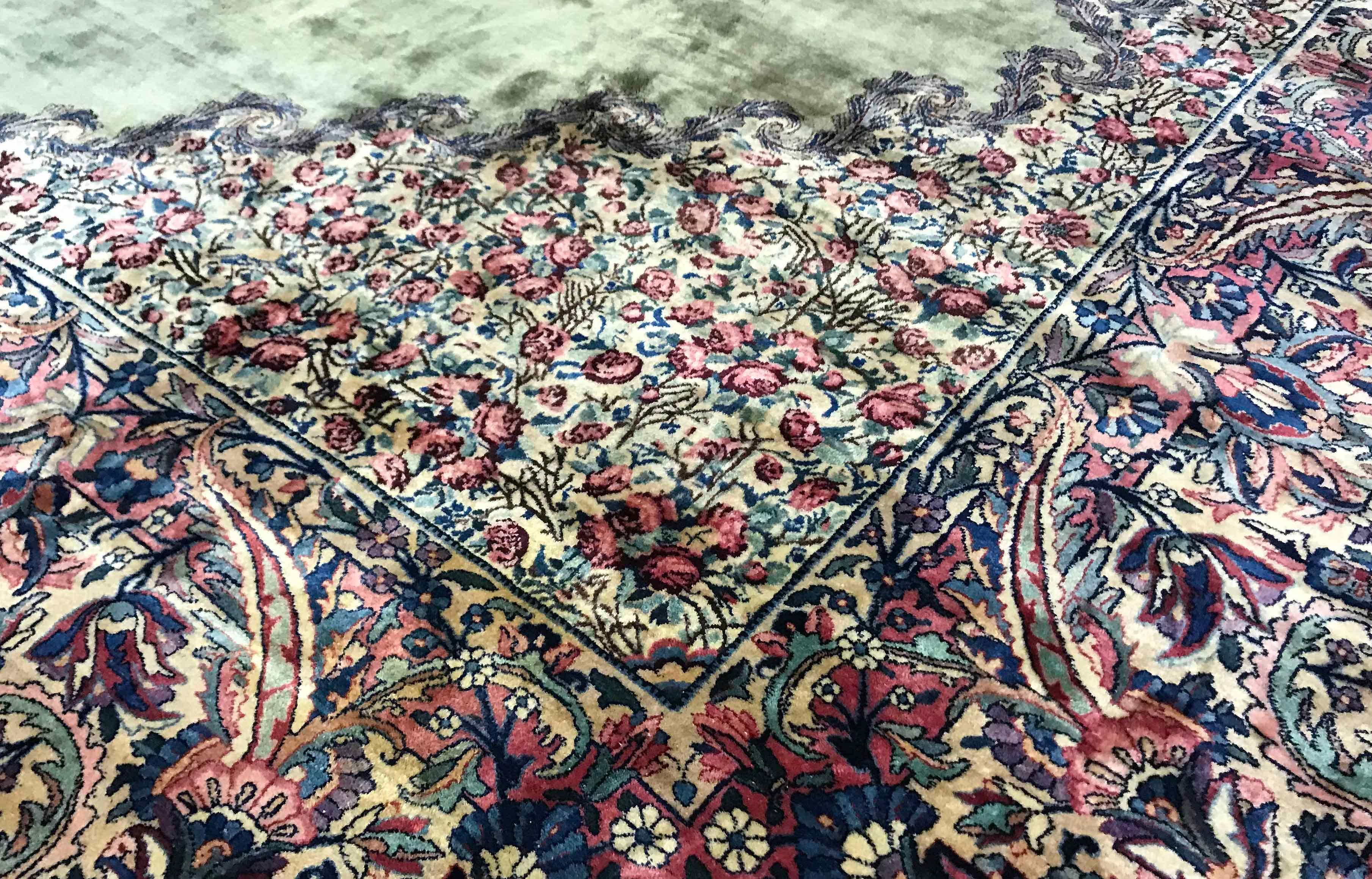 Vintage Persian Kerman, circa 1940. The soft green ground enclosing a floral medallion which has been woven in magnificent detail that truly shows the weavers skill and this superb design is repeated in the surrounding borders. Size: 11'7 x 18'9.